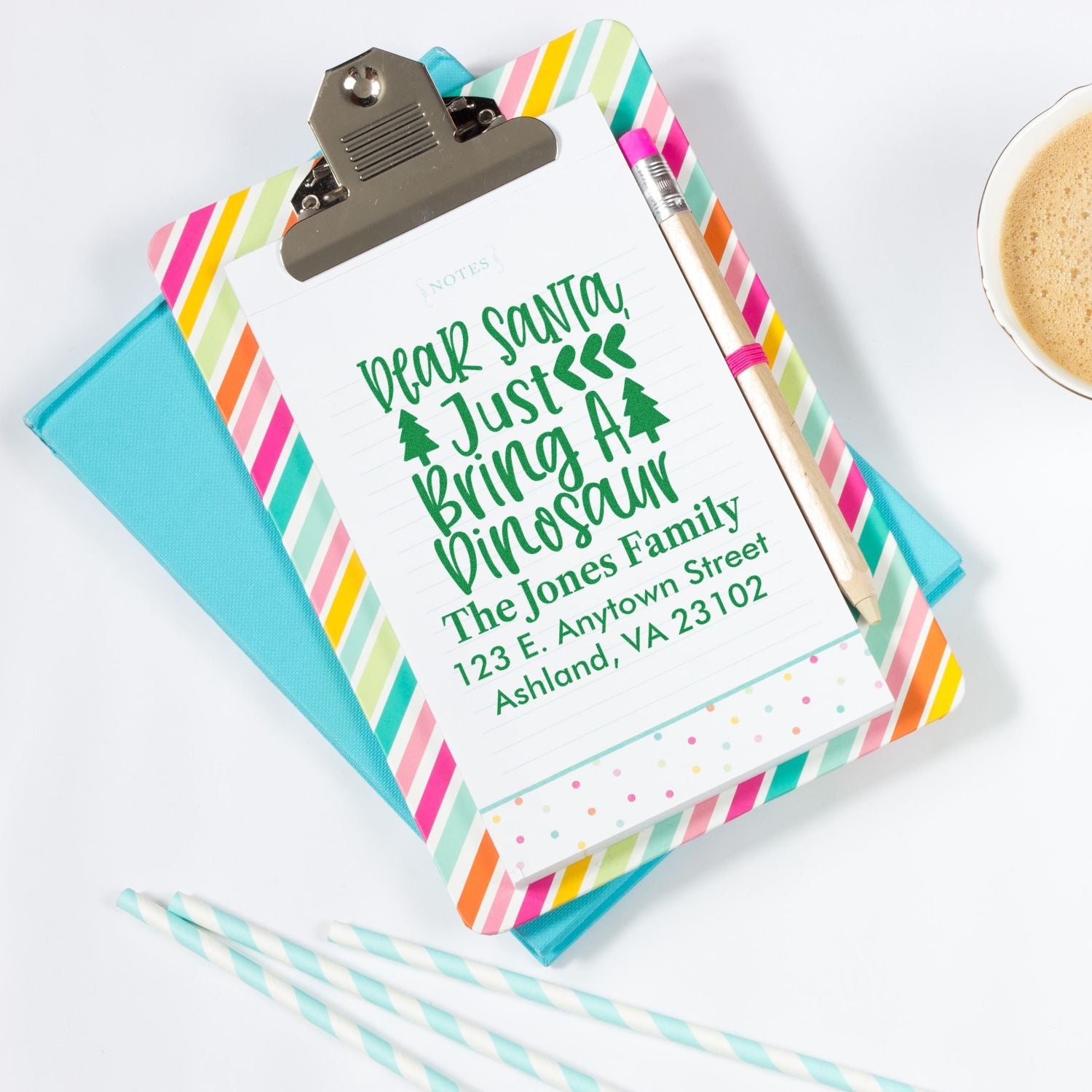 Custom Christmas rubber stamp with Dear Santa, Just Bring a Dinosaur message and personalized family return address.
