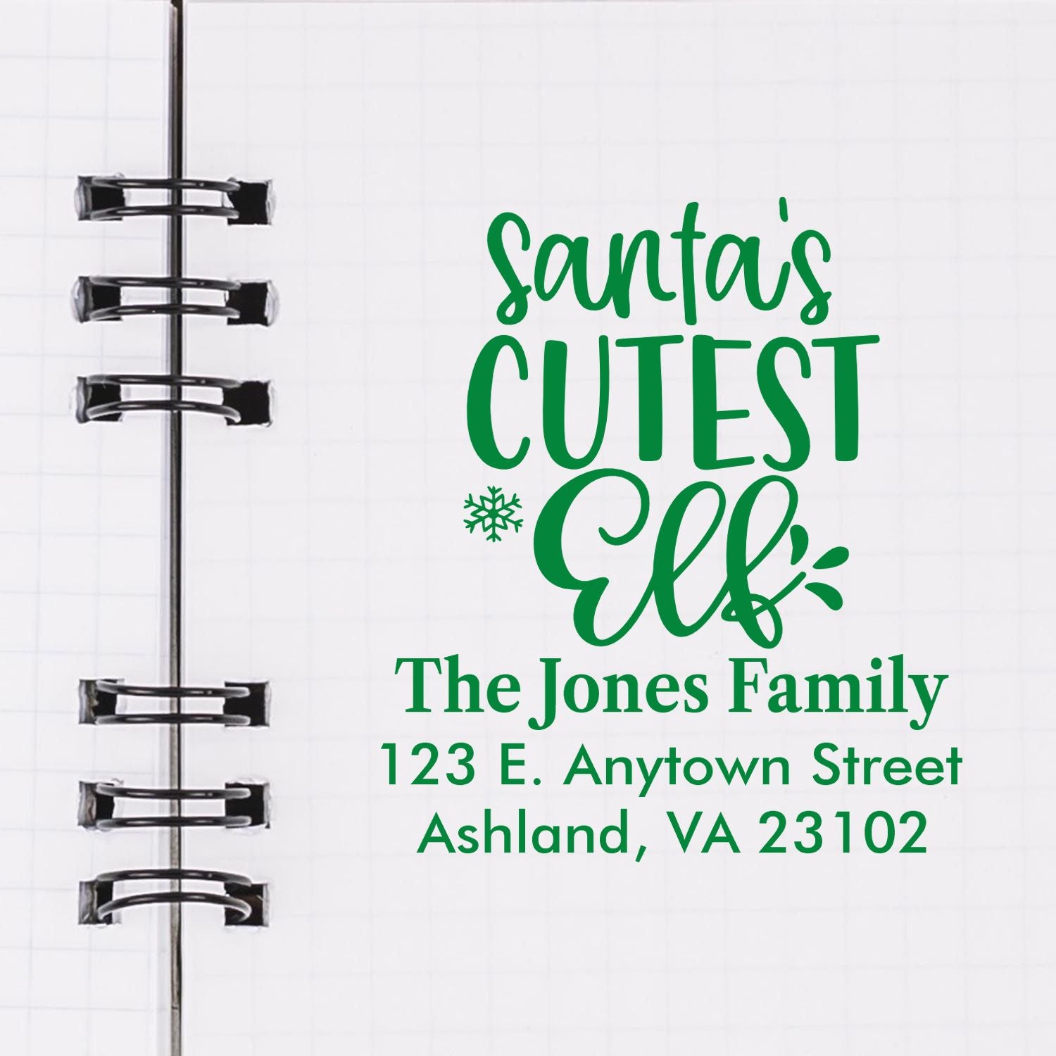 Personalized Christmas rubber stamp design with Santas Cutest Elf and custom family address for holiday cards and gifts.