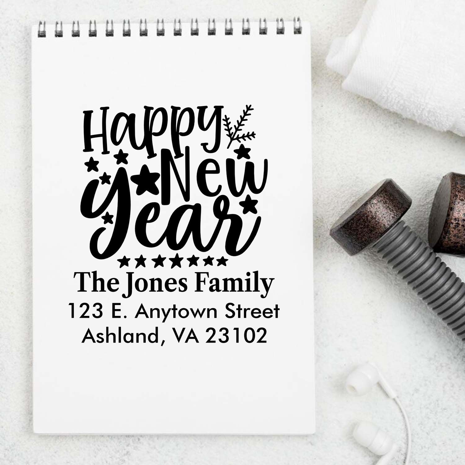 Custom Happy New Year rubber stamp design with family name and address for holiday cards and return mail.
