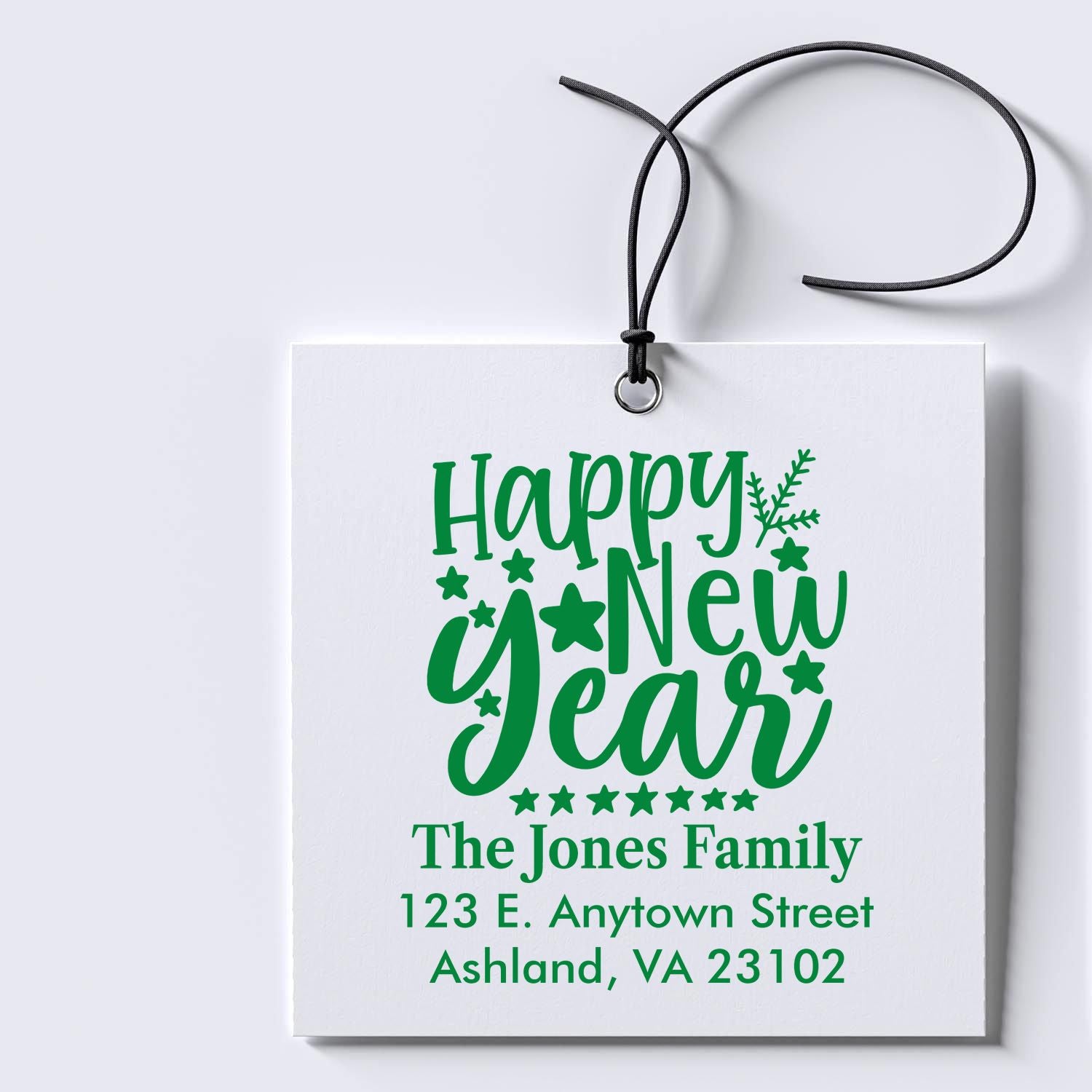 Personalized Happy New Year rubber stamp with family name and return address for holiday gift tags and cards.