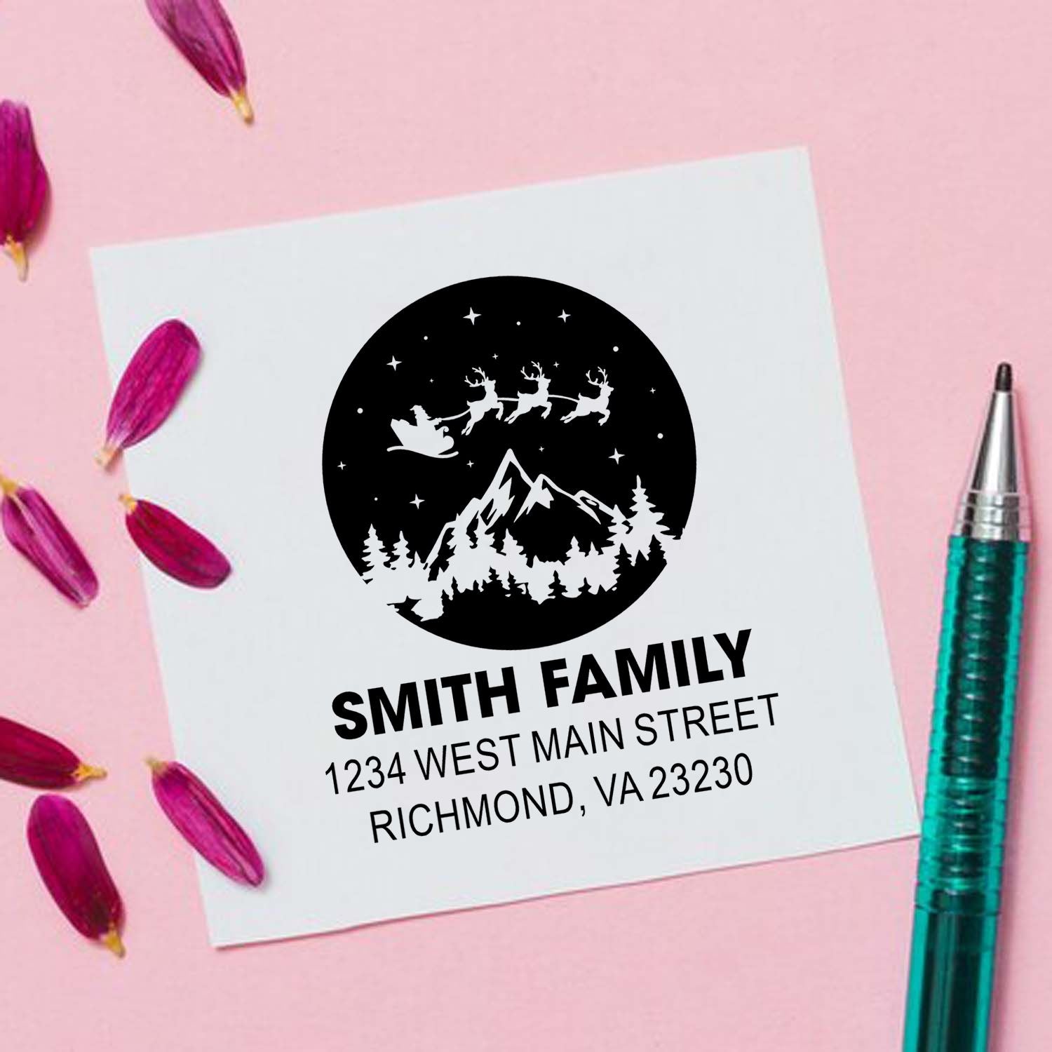 Custom family return address rubber stamp with Santa sleigh, mountain scene, and personalized name and address for holiday mail.