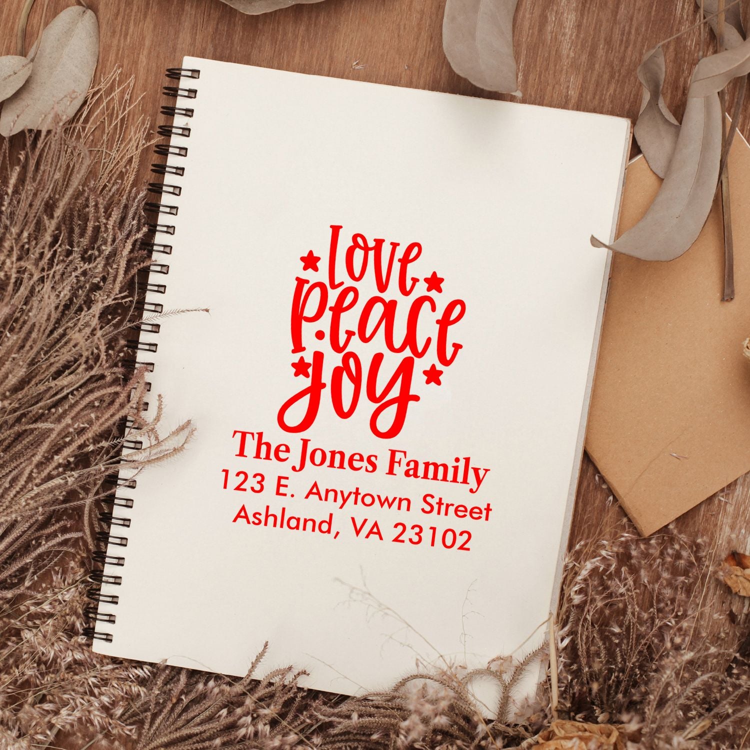 Personalized rubber address stamp with Love Peace Joy design for family stationery and holiday cards.