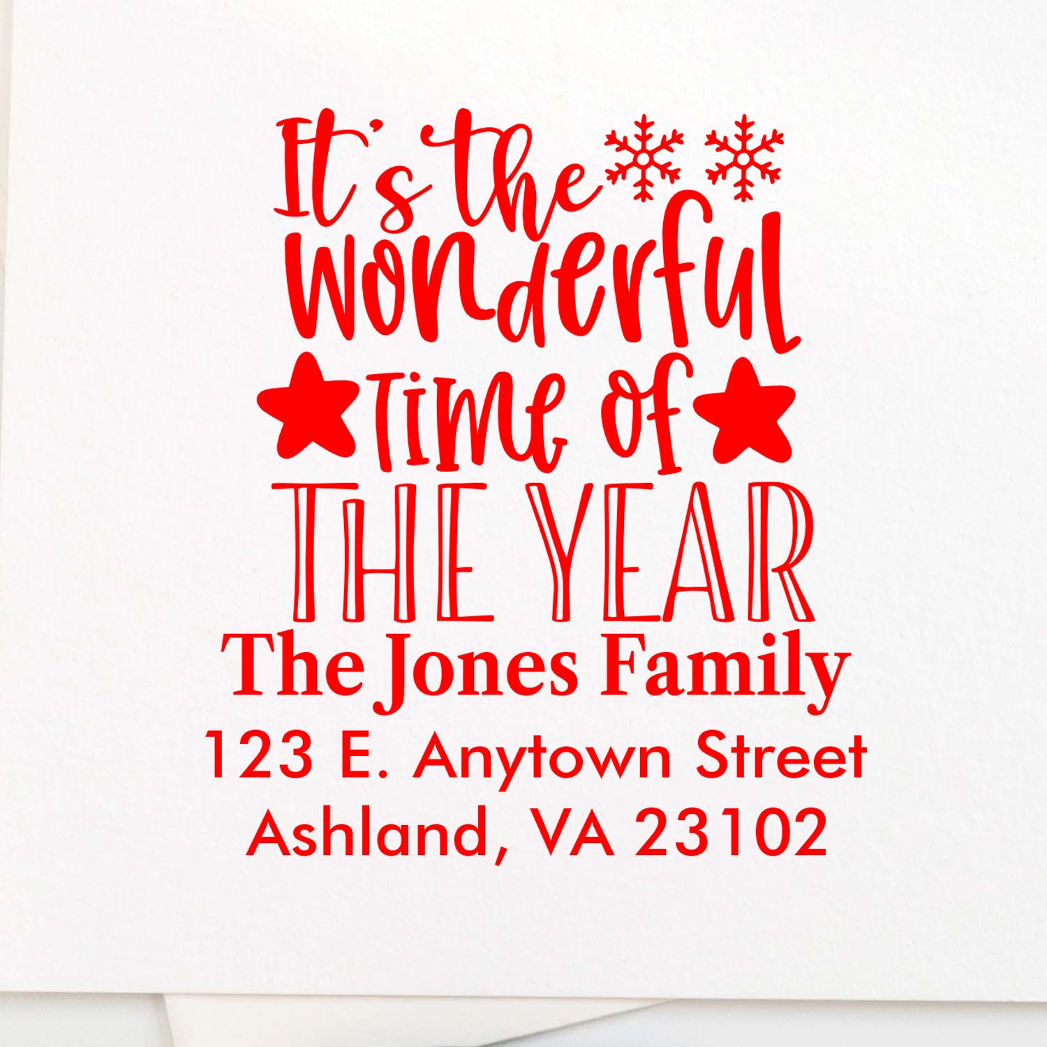 Personalized Christmas address rubber stamp with Its the Wonderful Time of the Year, family name, and return address.