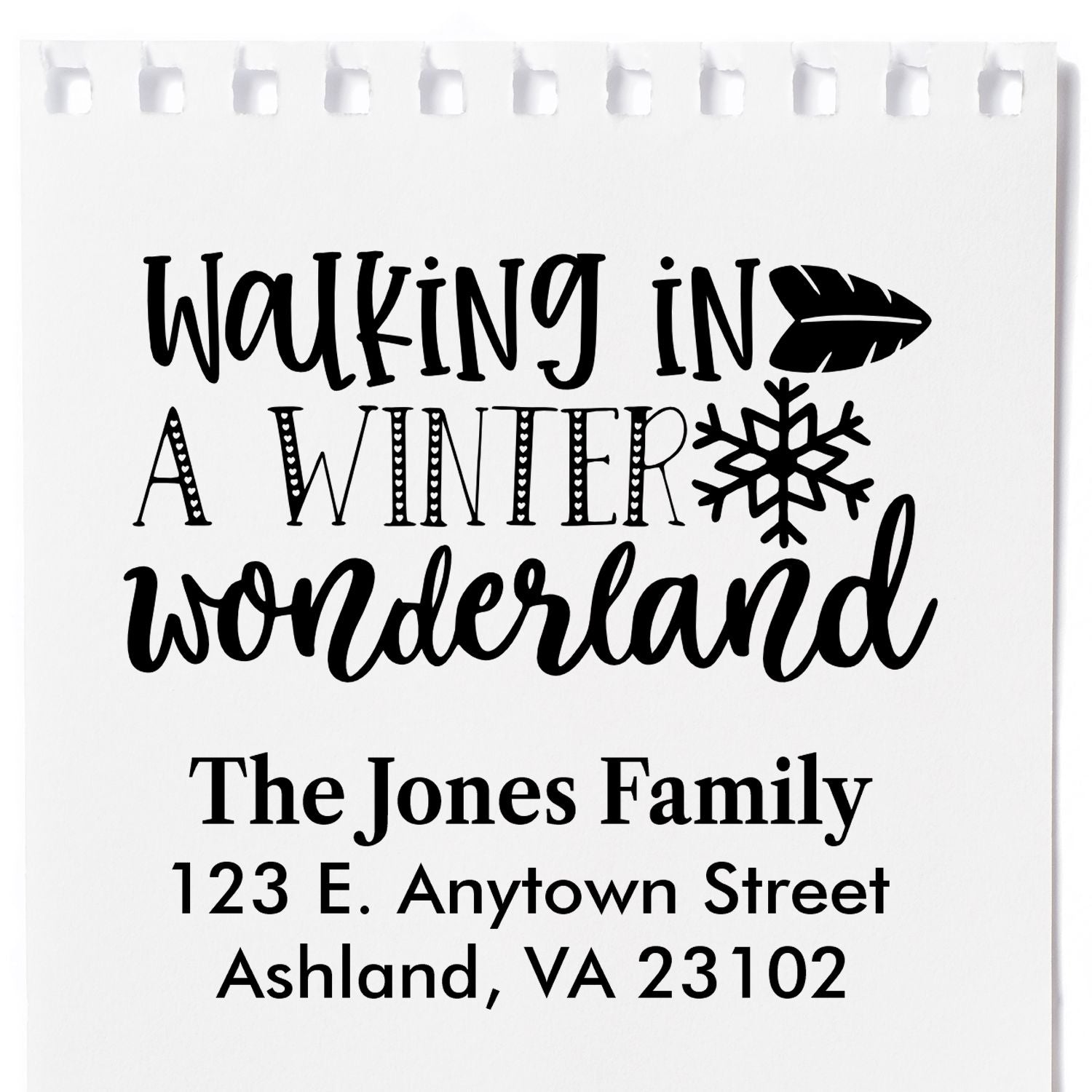 Custom rubber stamp design reading Walking in a Winter Wonderland with family name and address for holiday cards and envelopes.