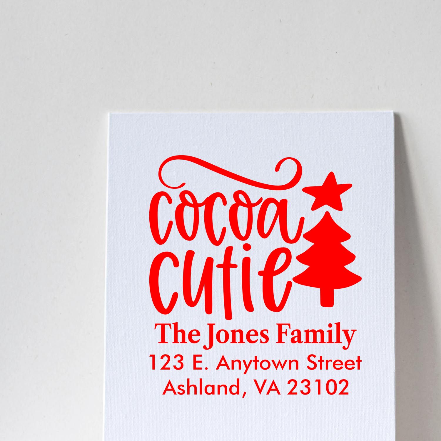 Custom Christmas rubber stamp design with Cocoa Cutie and personalized family address for holiday cards.