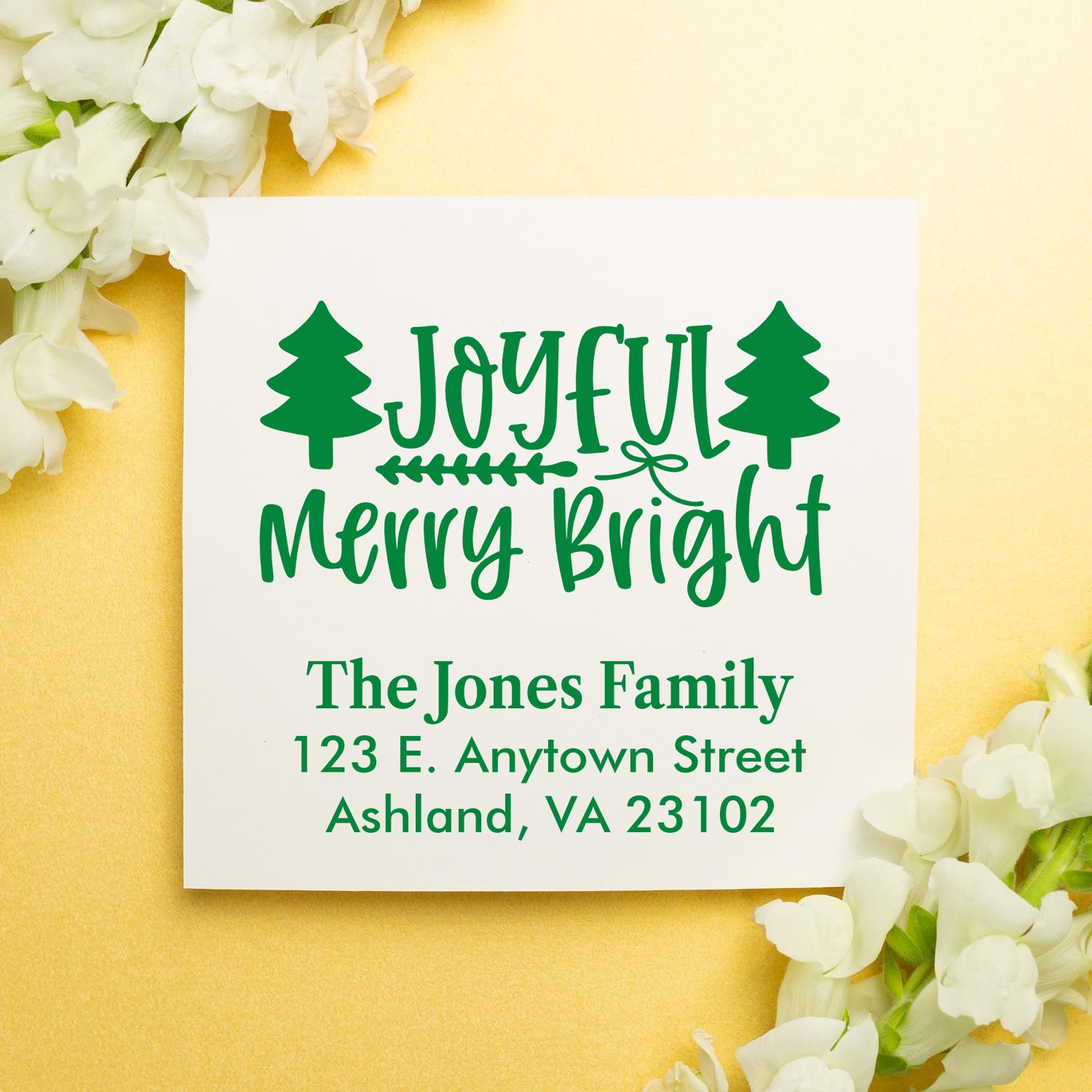 Personalized Christmas rubber stamp design with Joyful Merry Bright, pine trees, and family address for holiday cards.