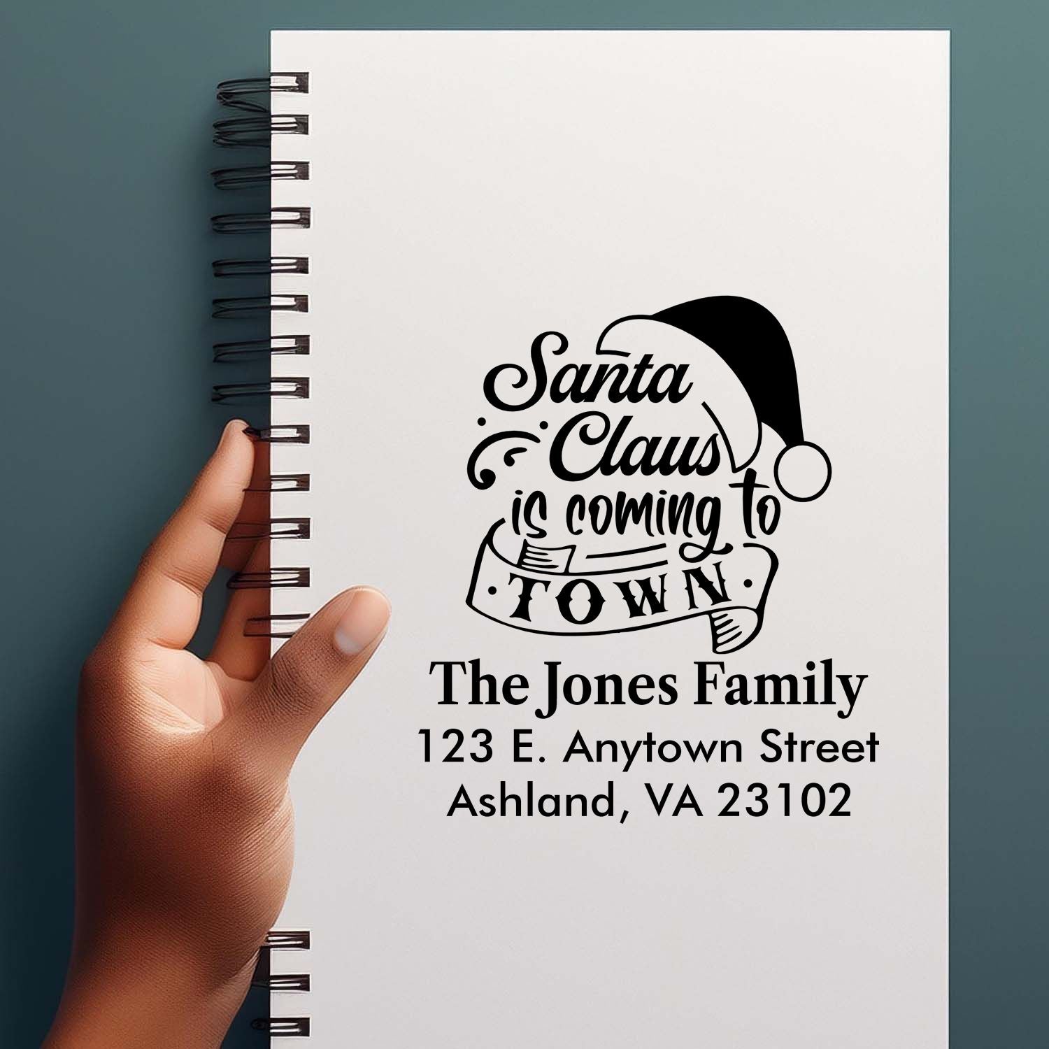 Custom Christmas rubber stamp with Santa Claus is Coming to Town and personalized family address.