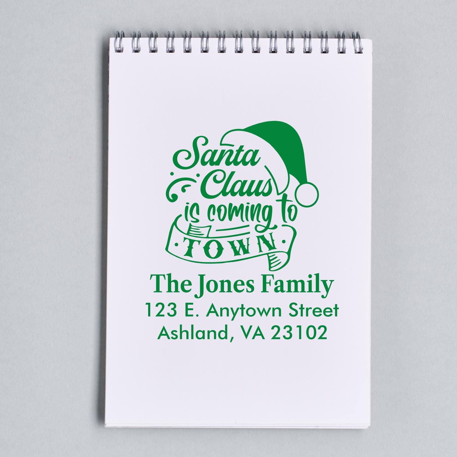 Personalized Christmas return address rubber stamp with Santa Claus is Coming to Town design for holiday mailings.