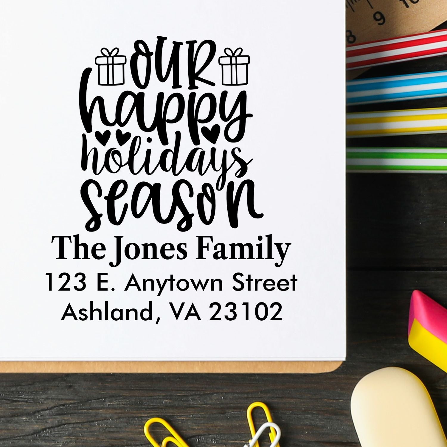 Custom holiday rubber stamp with our happy holidays season and family address for Christmas cards and seasonal mailings.