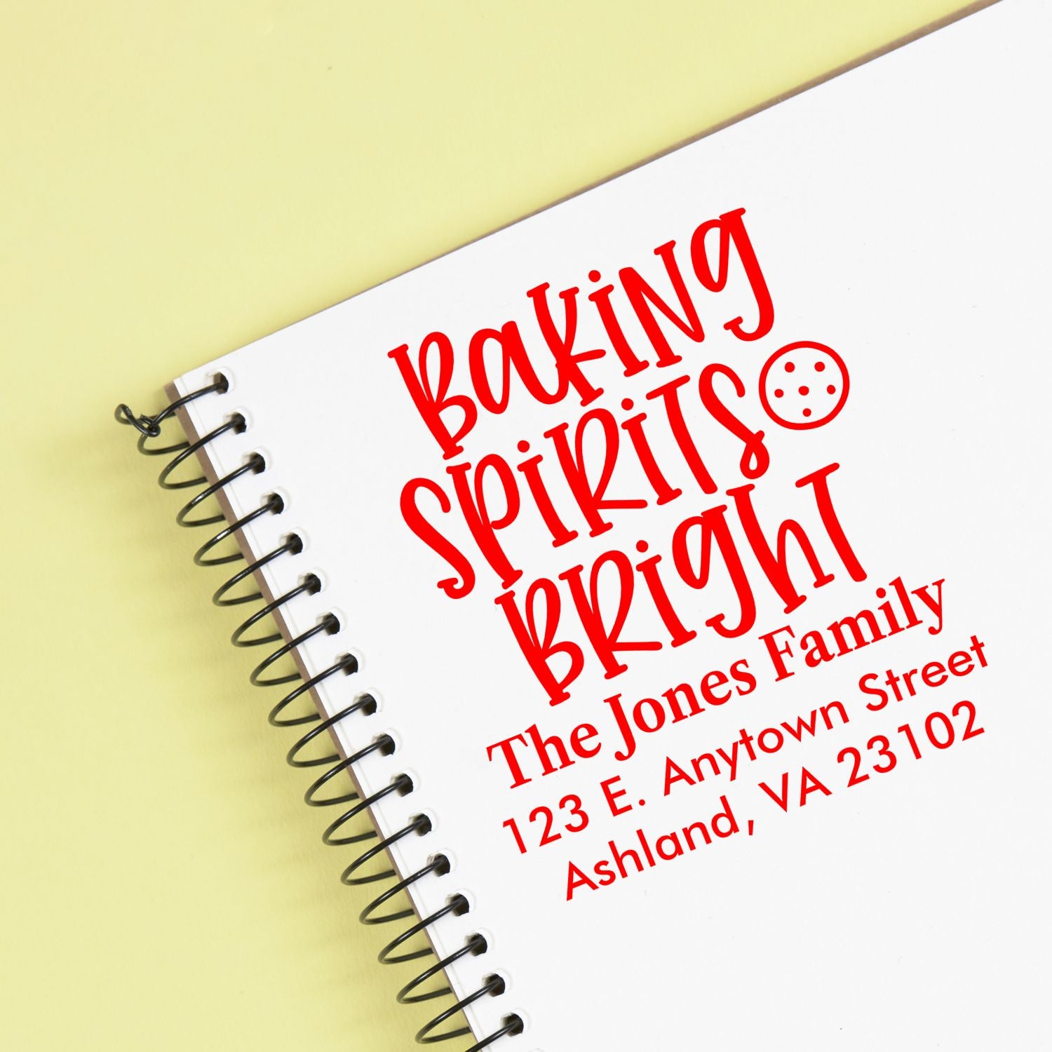 Custom address rubber stamp reading Baking Spirits Bright with The Jones Family and Ashland, VA address.