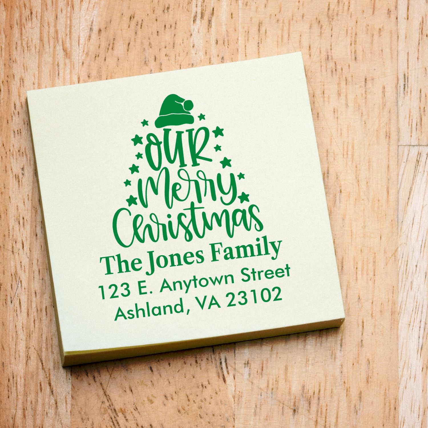 Personalized Merry Christmas return address rubber stamp for The Jones Family, featuring a festive Santa hat tree design.