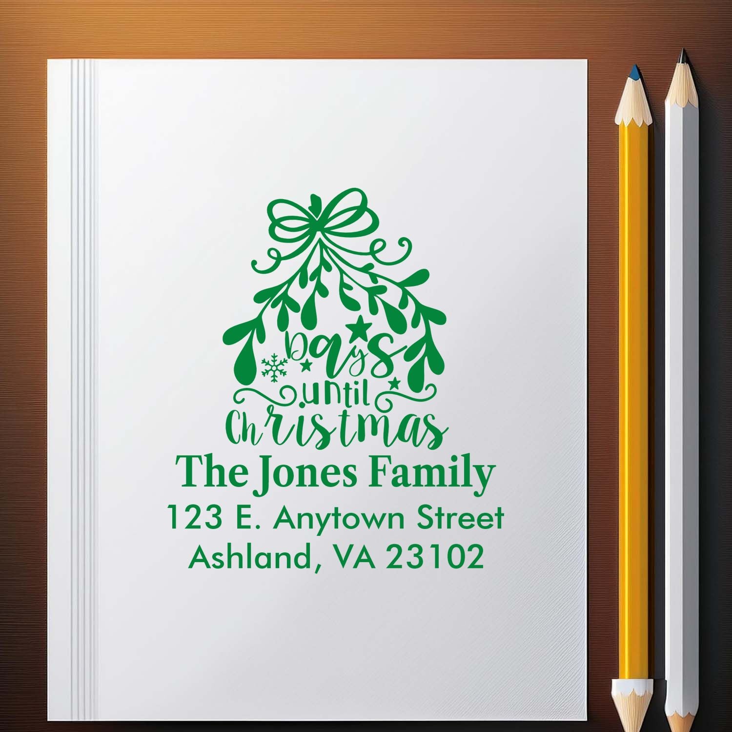 Custom Christmas return address rubber stamp with festive bow design for The Jones Family, Ashland, VA 23102