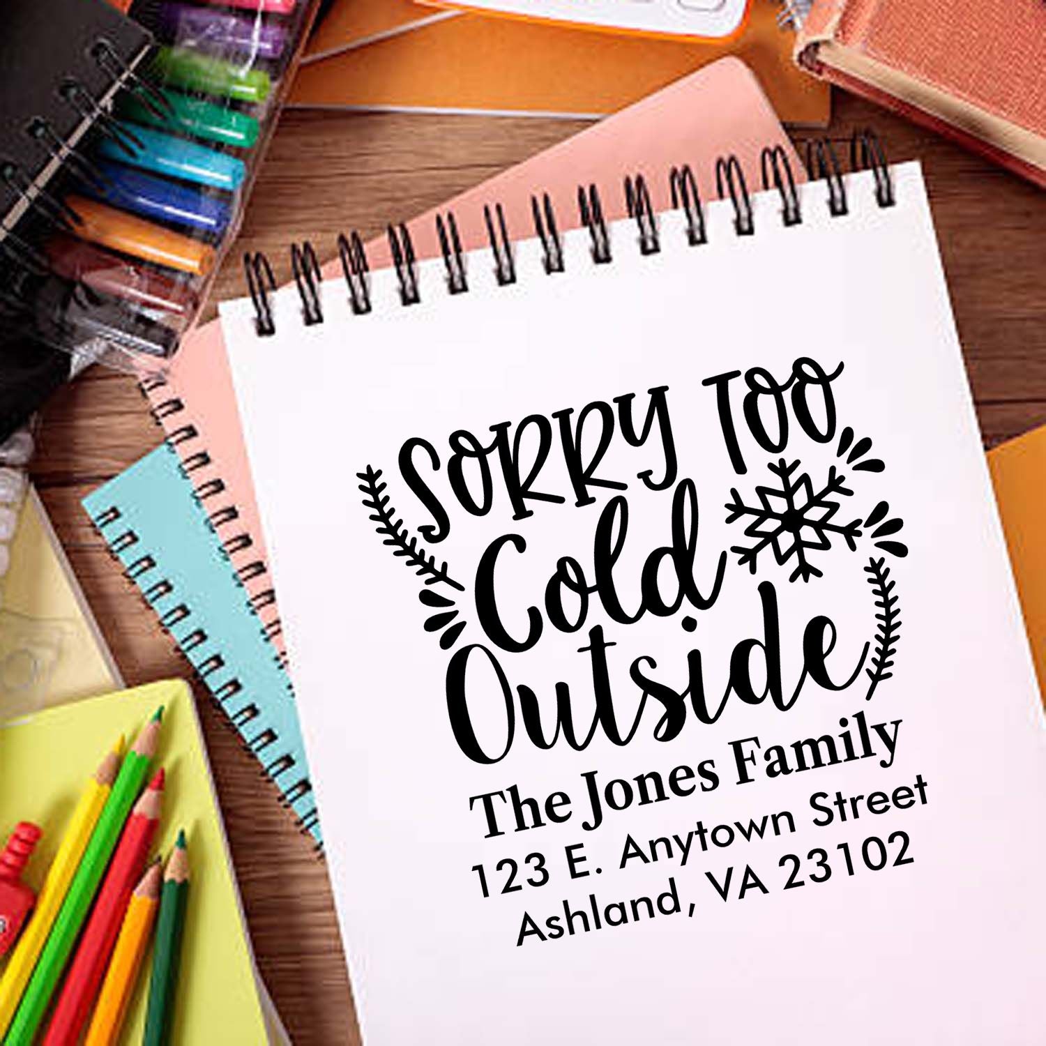Custom rubber stamp design reading Sorry Too Cold Outside with family name and address for personalized holiday mailers
