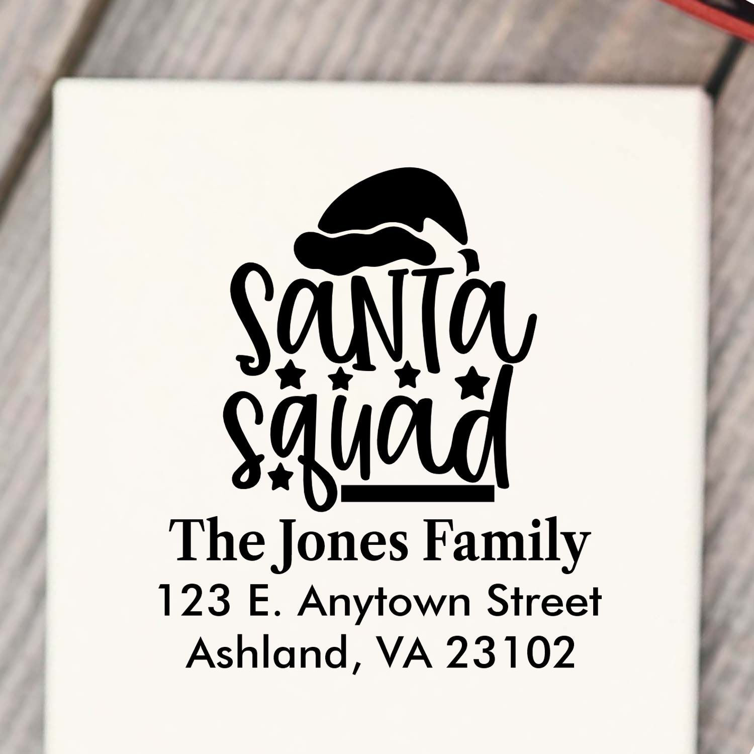 Custom Santa Squad rubber stamp with family name and return address for Christmas cards and holiday mailings.