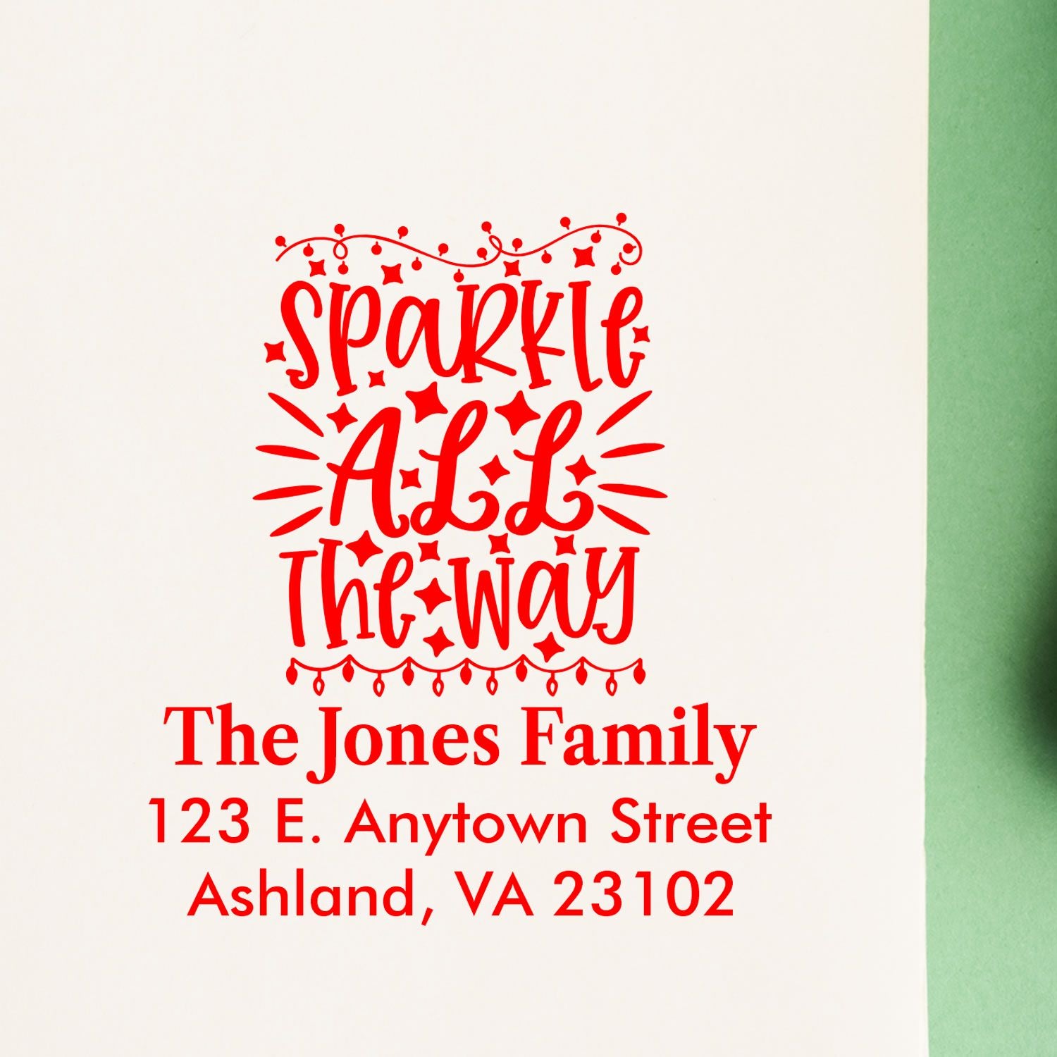 Custom Christmas rubber stamp with Sparkle All the Way, family name, and return address for holiday cards.