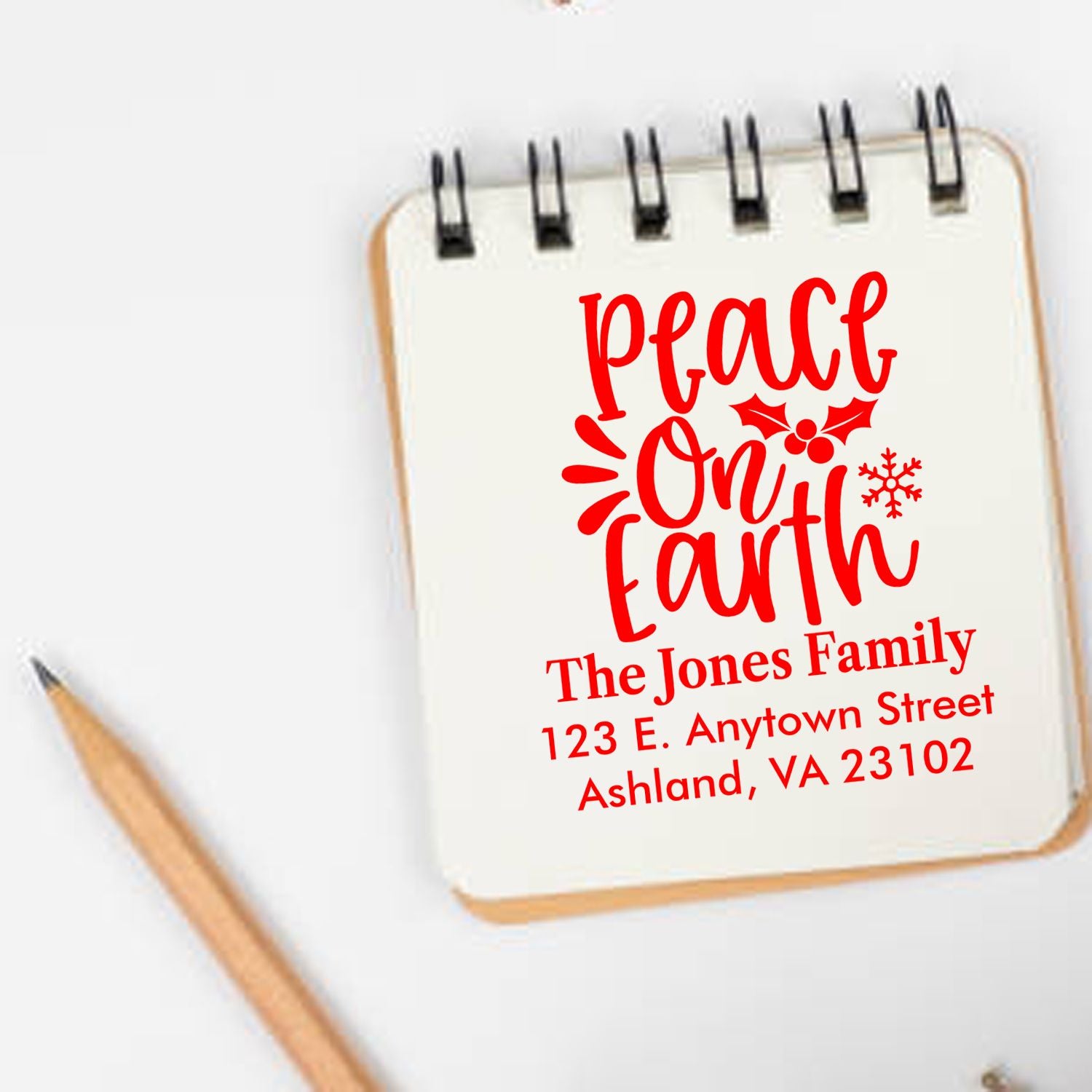 Personalized Peace on Earth holiday rubber stamp with family name and return address