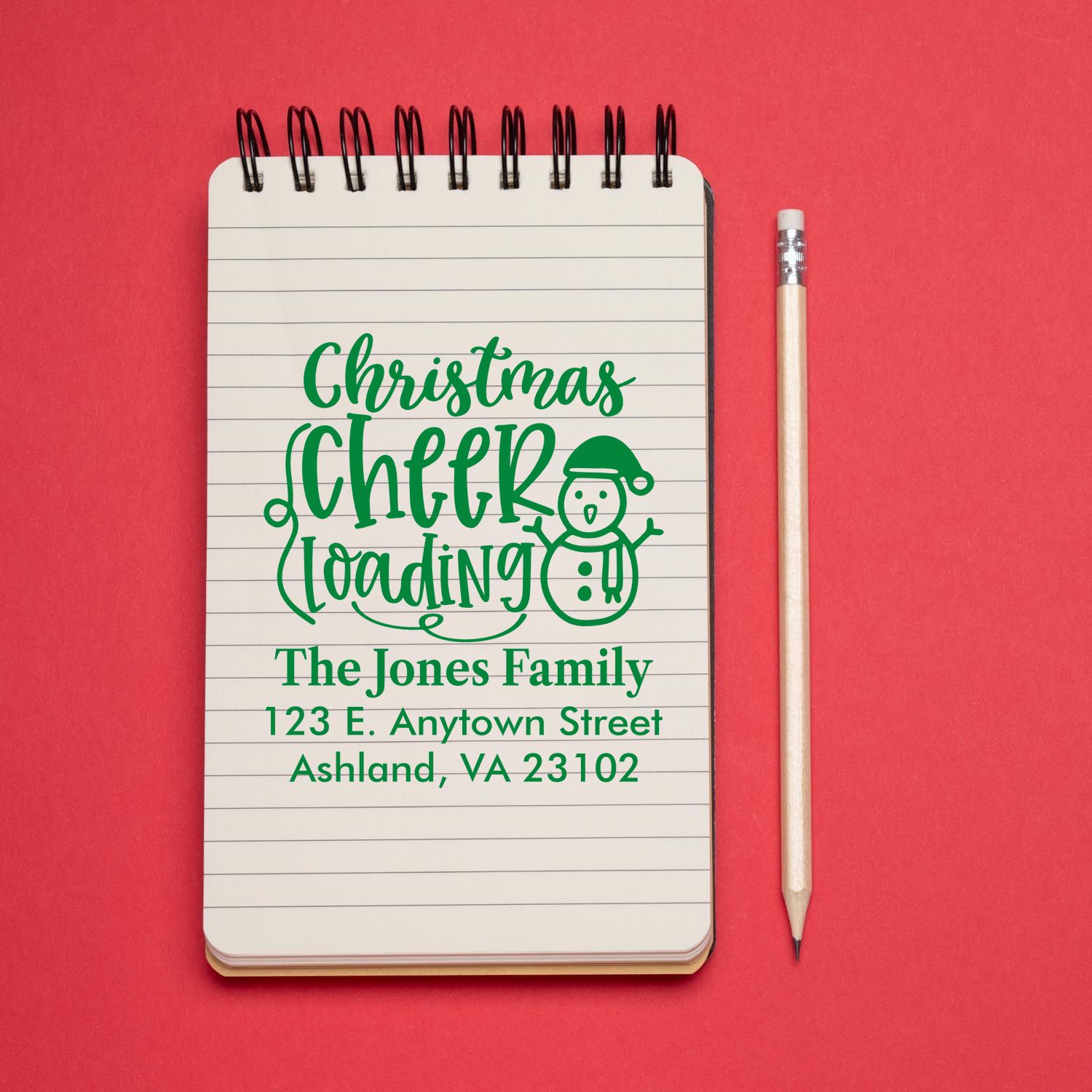 Custom holiday return address rubber stamp with Christmas Cheer Loading snowman and family address.