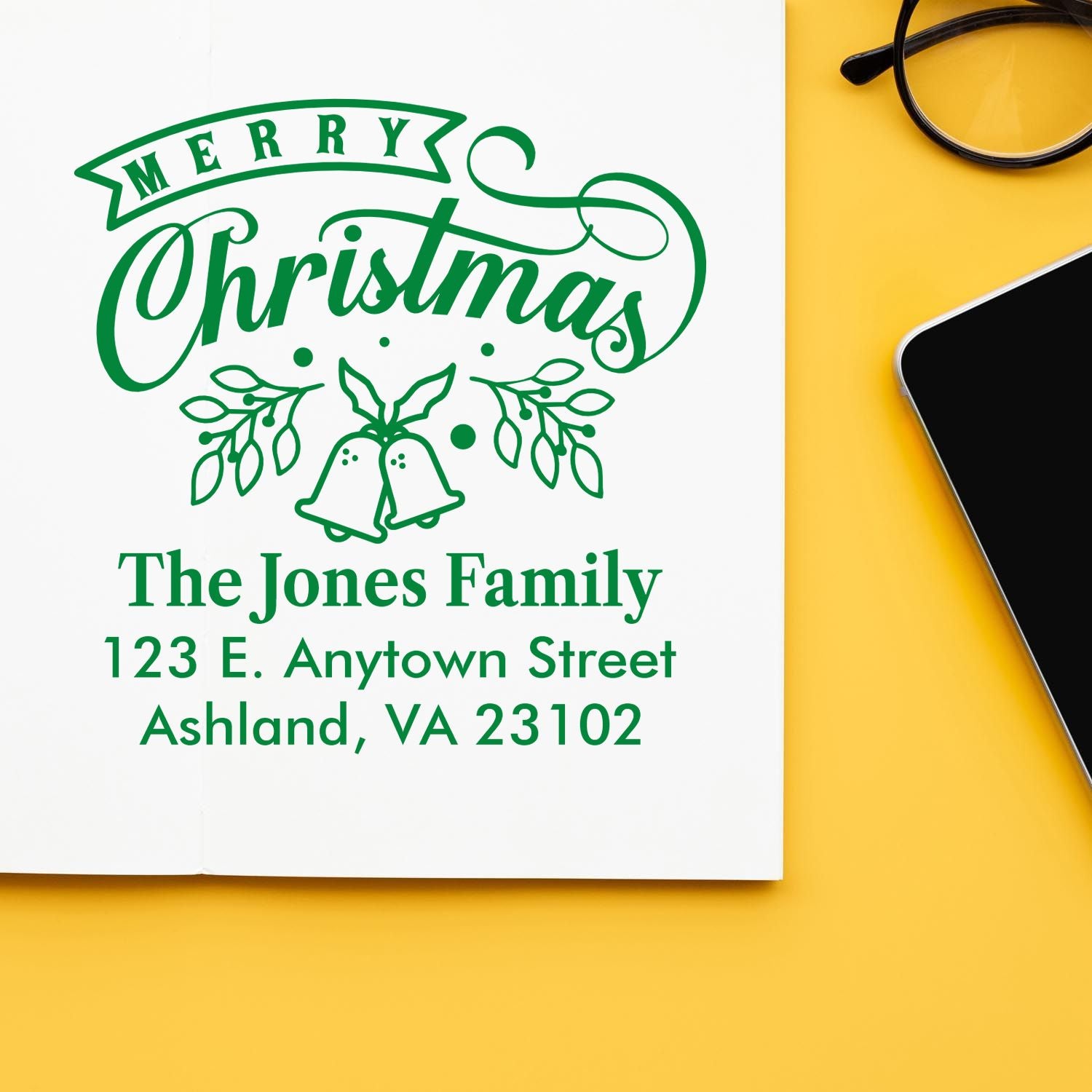 Custom Christmas return address rubber stamp with Merry Christmas, bells, and family name for holiday cards.