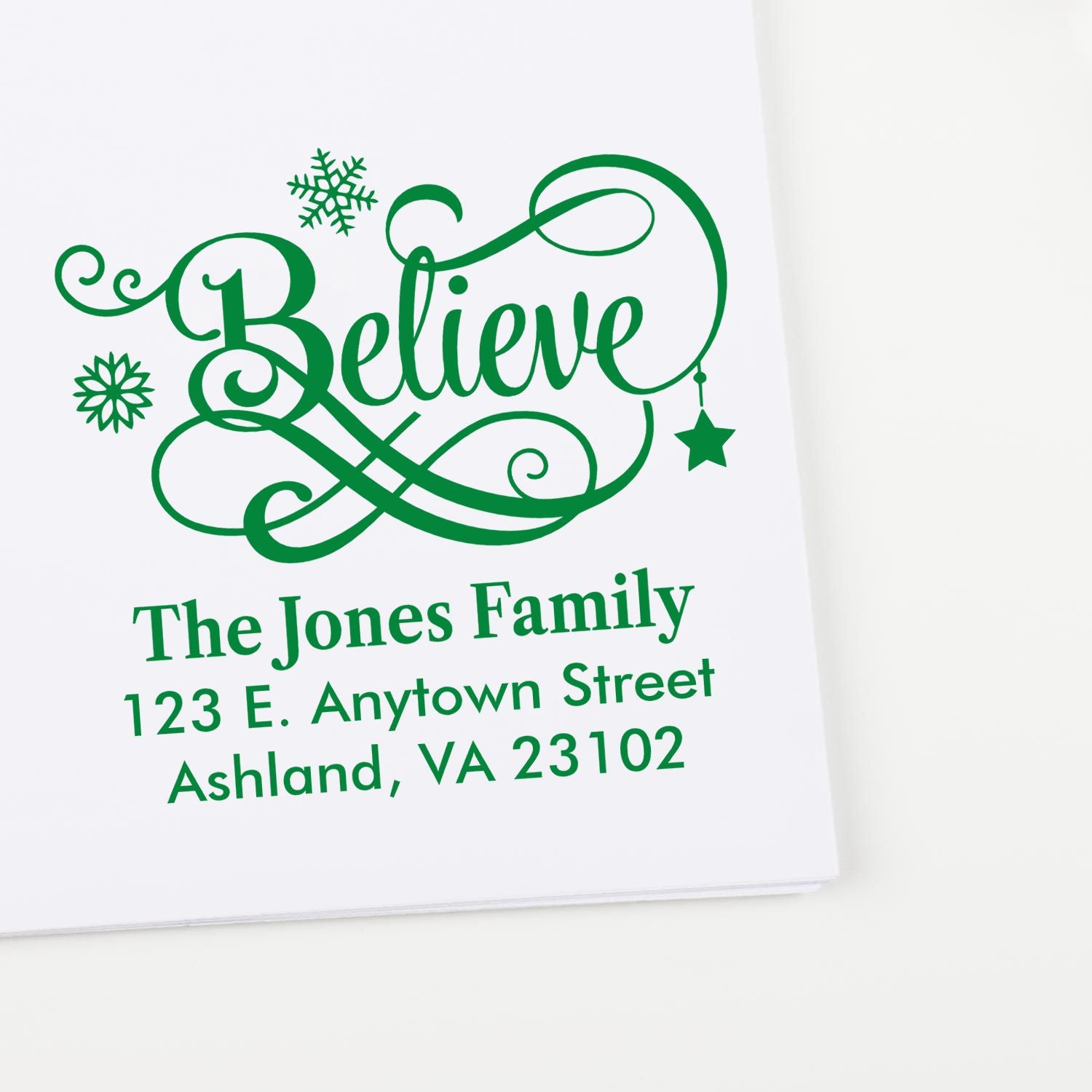 Custom holiday return address rubber stamp with ornate Believe design for the Jones family
