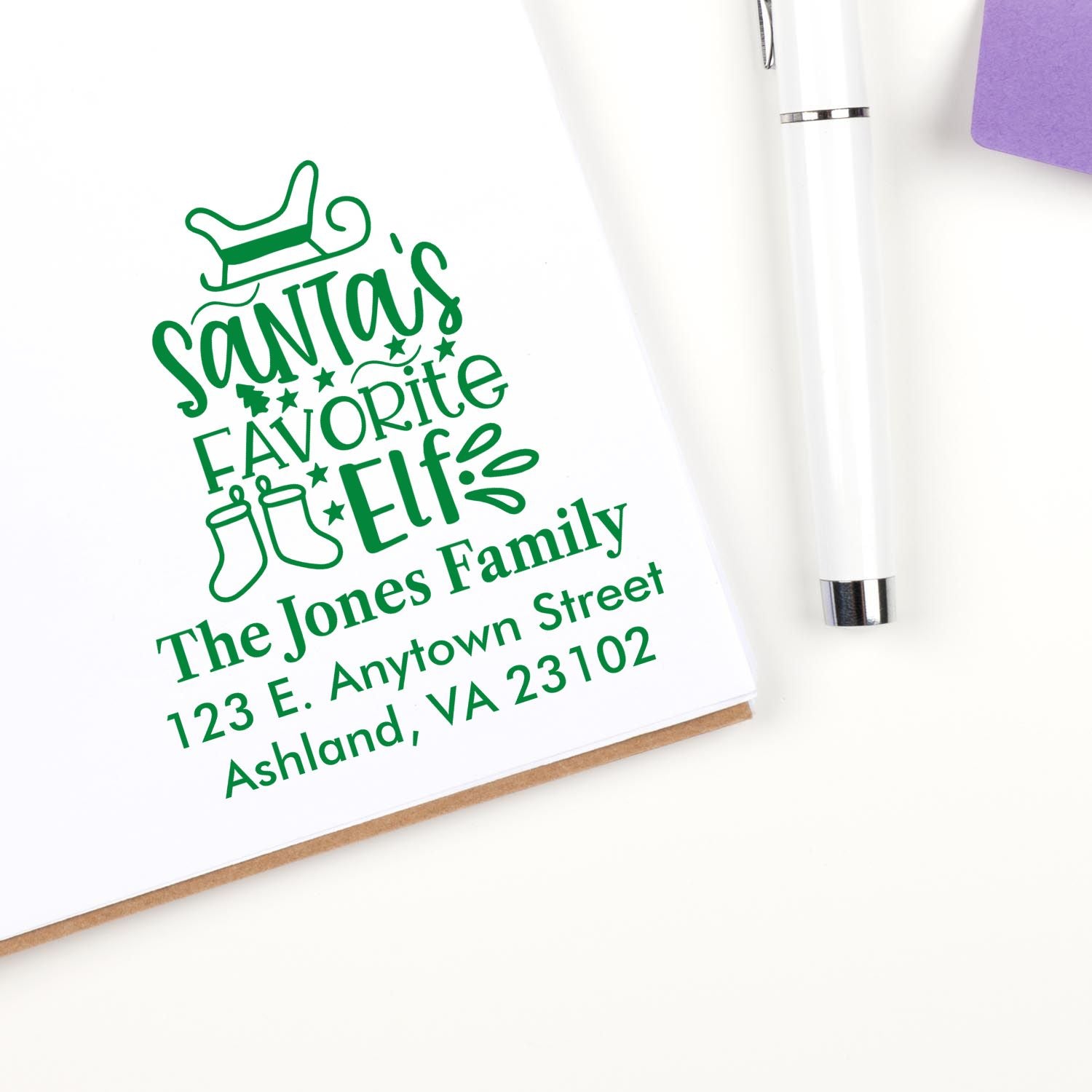 Personalized Christmas rubber stamp for The Jones Family, featuring Santas favorite elf and return address.