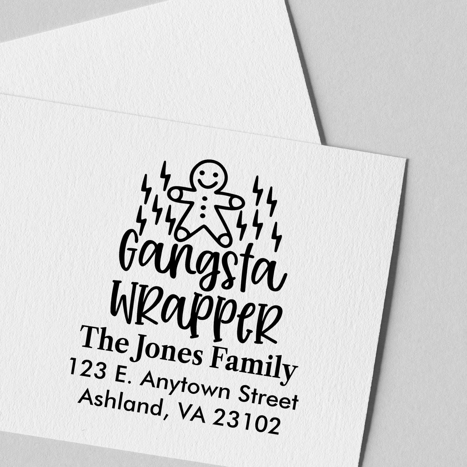 Custom return address rubber stamp with gingerbread man design for The Jones Family holiday cards.