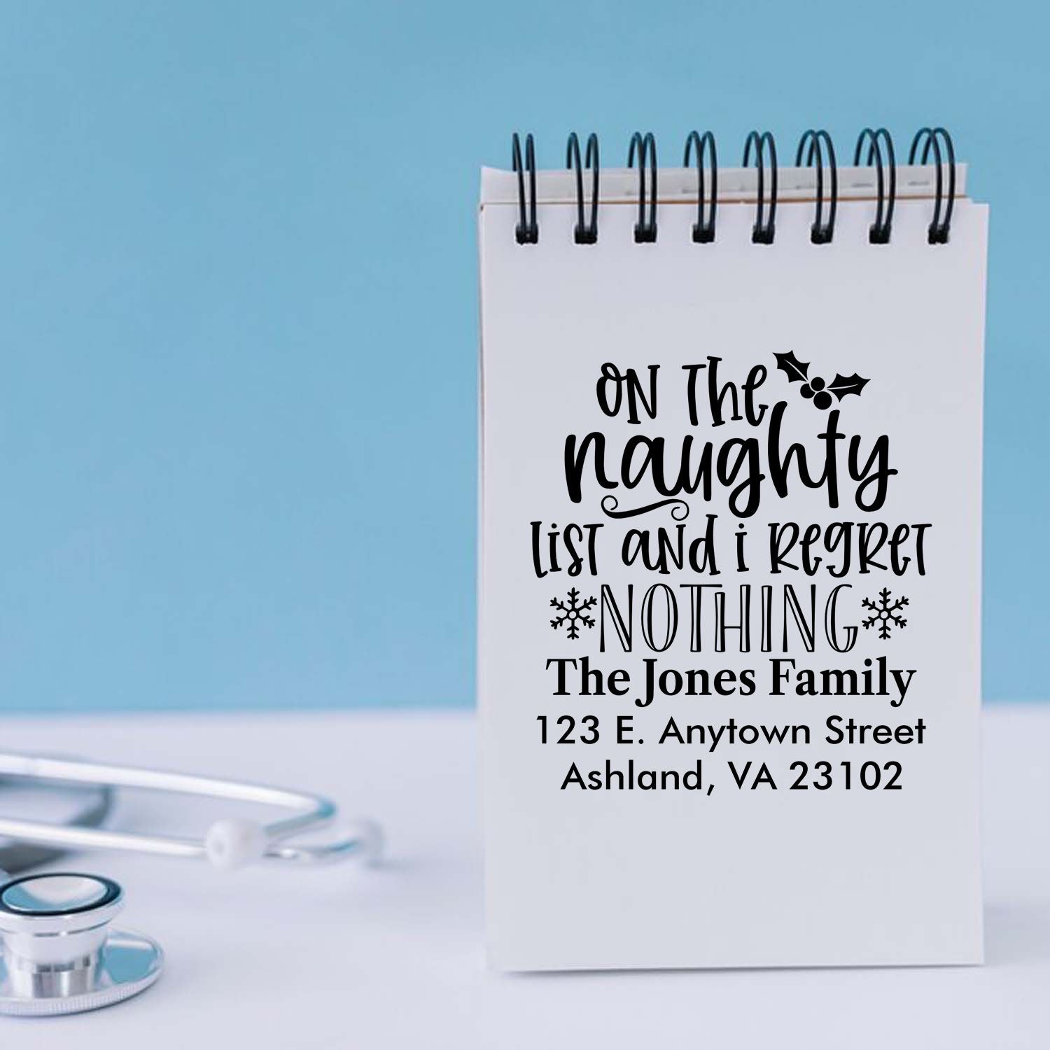 Personalized Christmas rubber stamp with naughty list quote and return address for holiday cards.