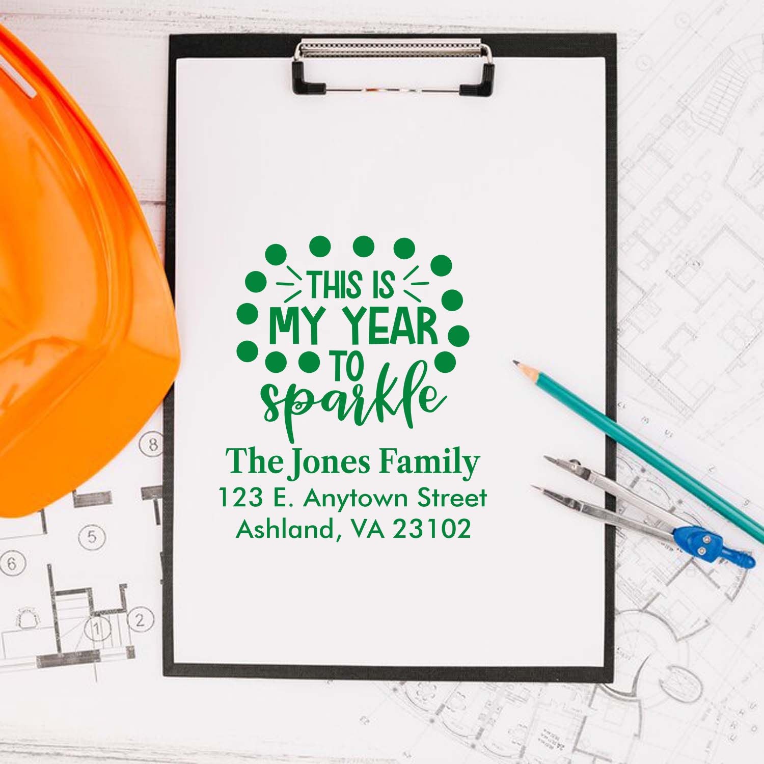 Personalized rubber stamp design reading This Is My Year to Sparkle with family name and address on a clipboard.