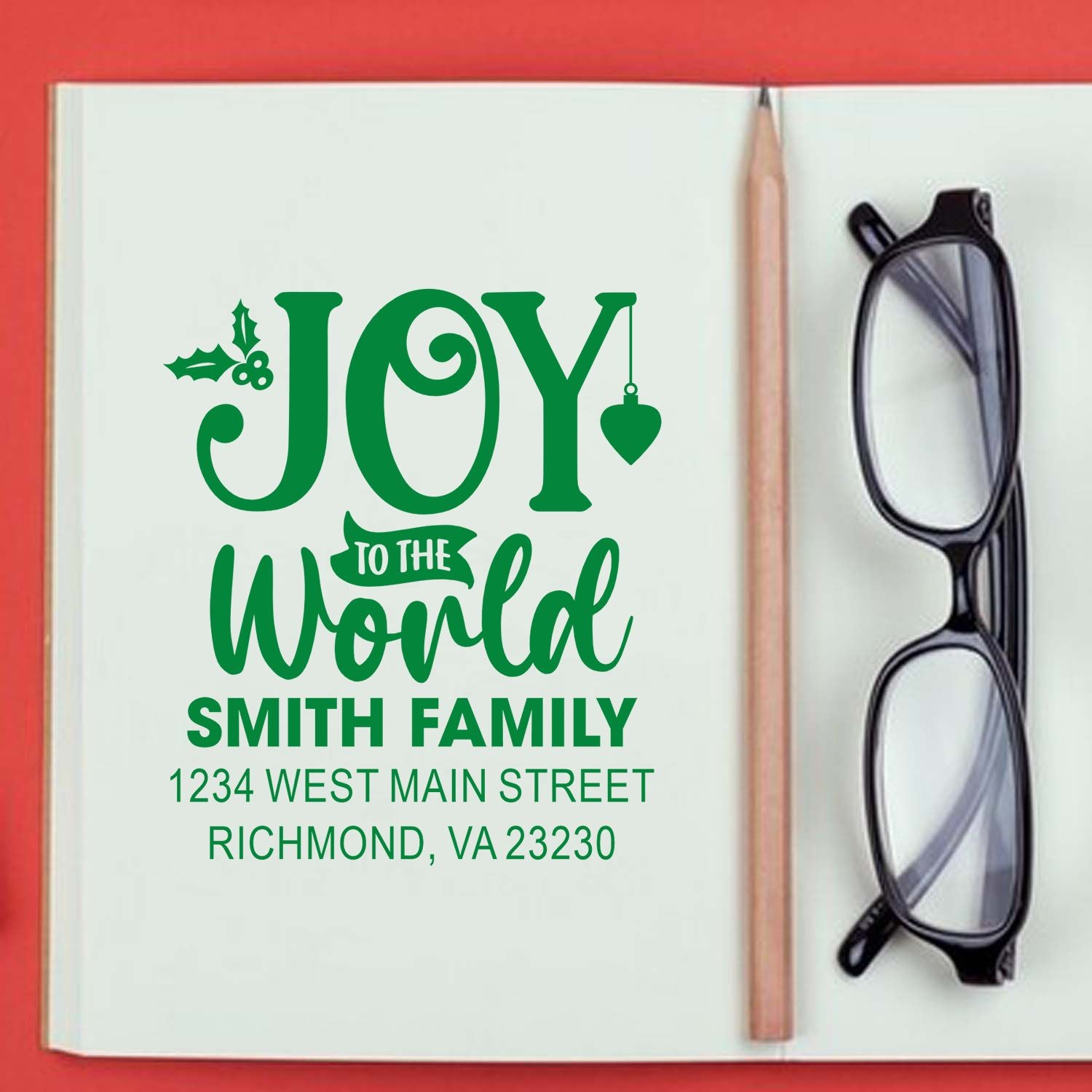 Custom Joy to the World Christmas rubber stamp with Smith family name and return address.