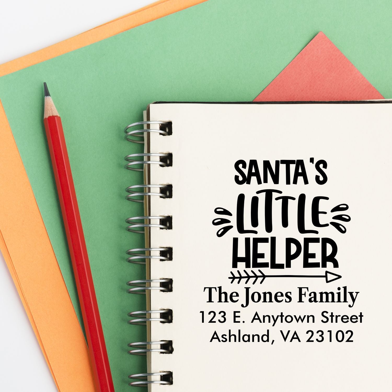 Custom Santas Little Helper return address rubber stamp design for Christmas cards, with family name and address.