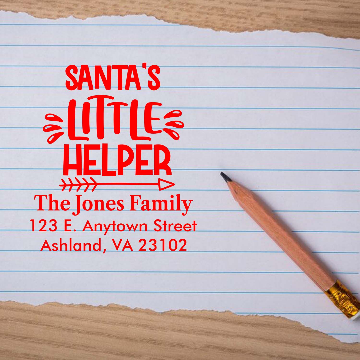 Personalized Santas Little Helper rubber stamp with family name and address for Christmas cards.