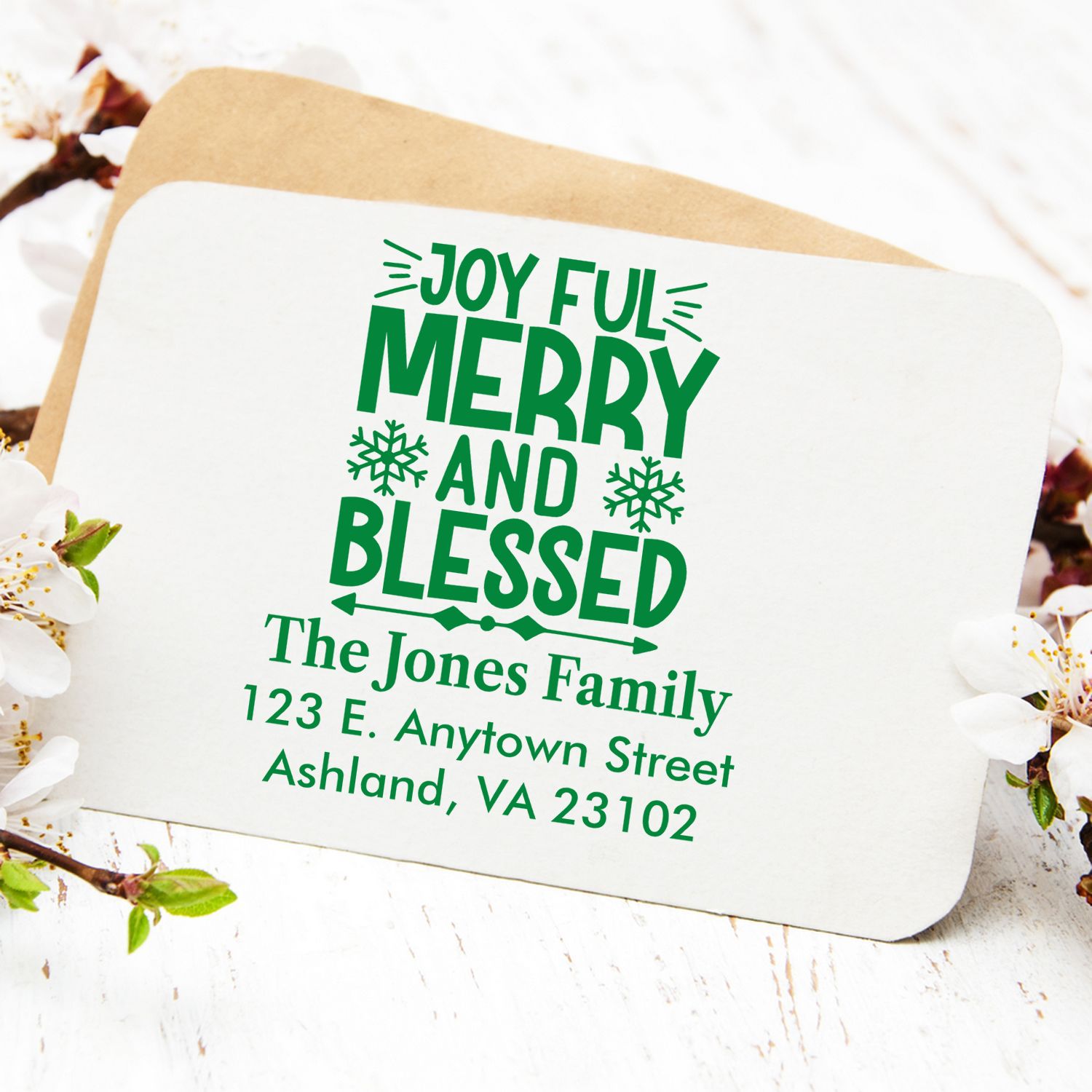 Personalized holiday rubber stamp with Joyful Merry and Blessed message, family name, and return address for Christmas cards.