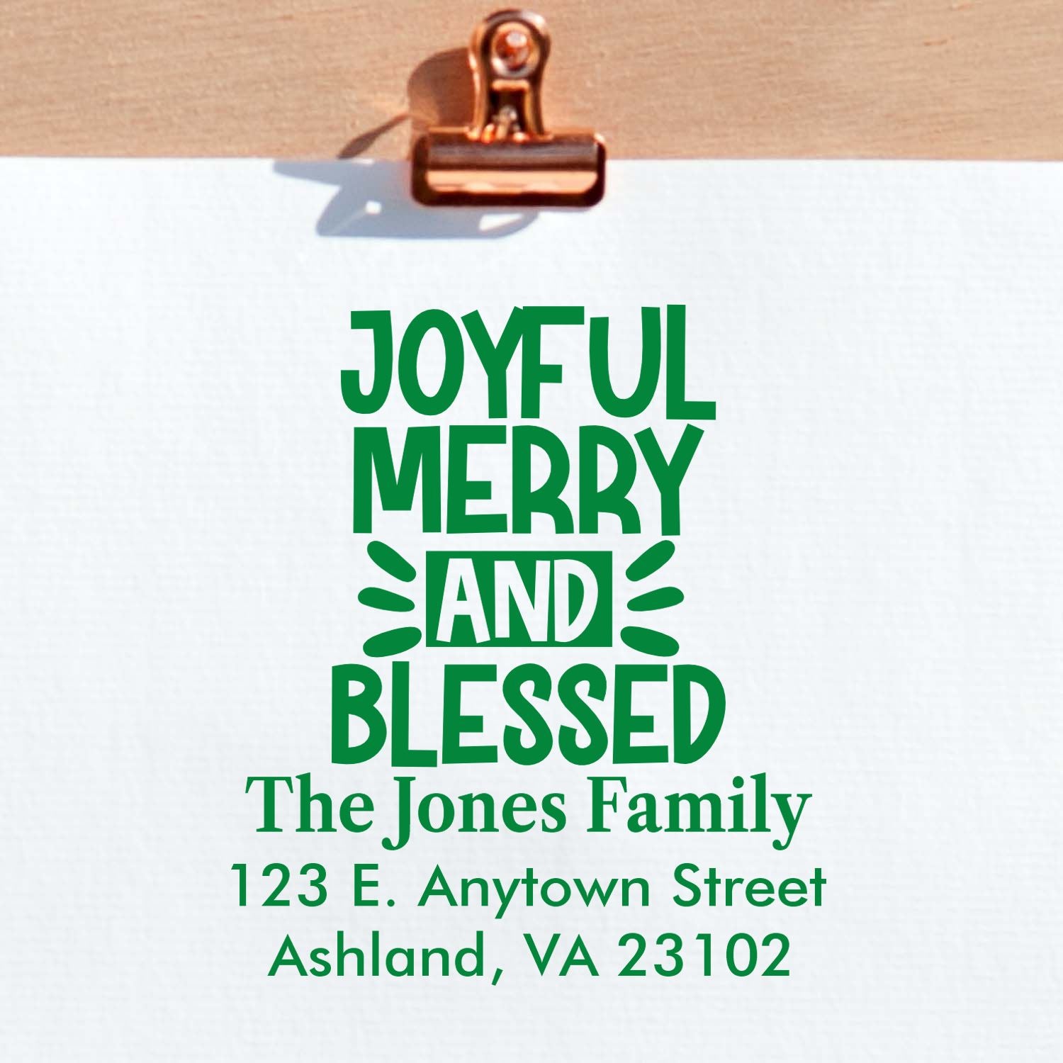 Personalized holiday rubber stamp design reading Joyful, Merry and Blessed with The Jones Family address.