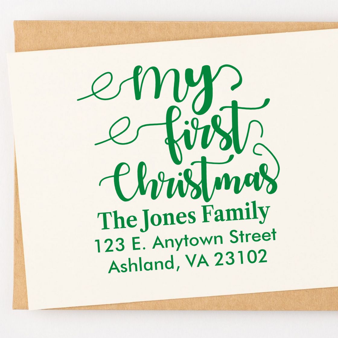Custom My First Christmas rubber stamp design with family name and return address for holiday cards.