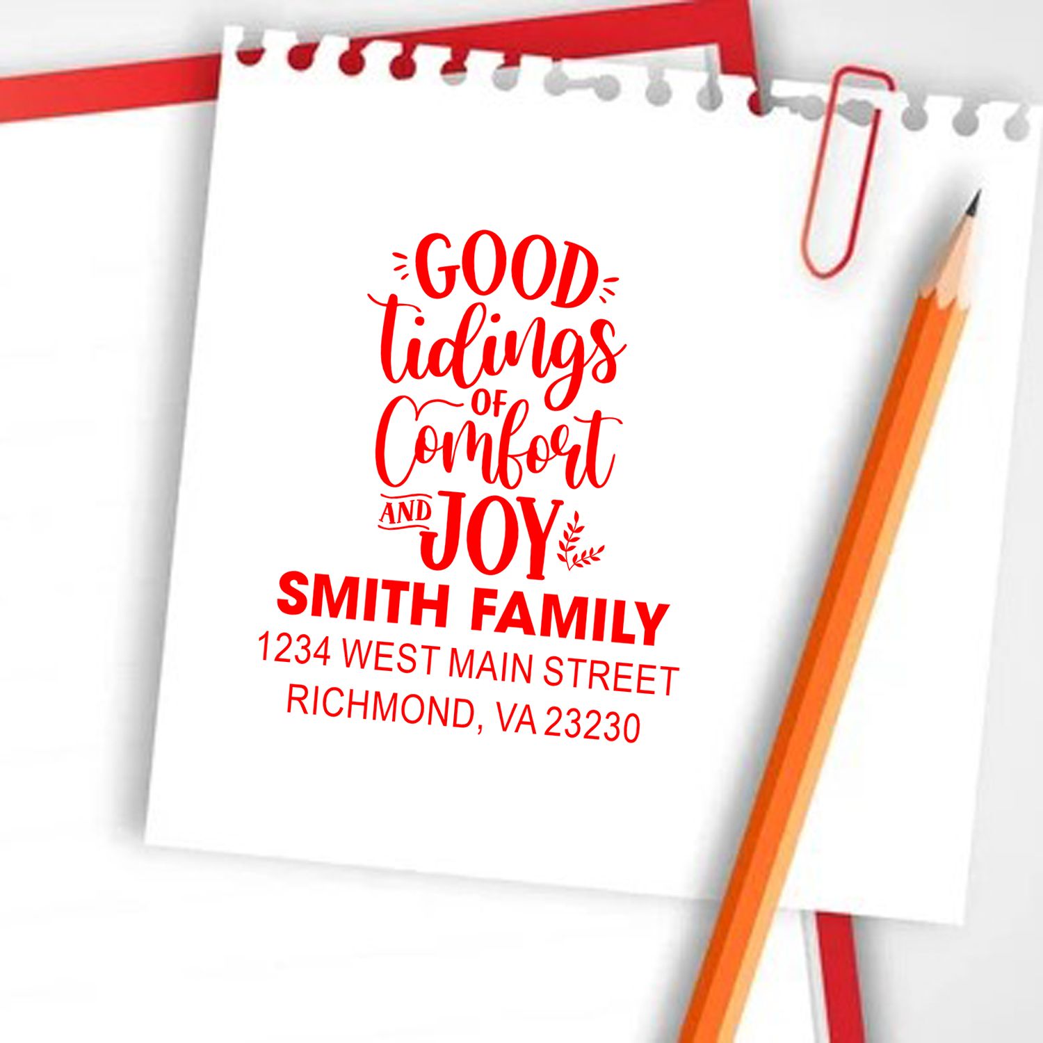 Custom Christmas rubber stamp design with Good Tidings of Comfort and Joy, Smith family name, and return address.