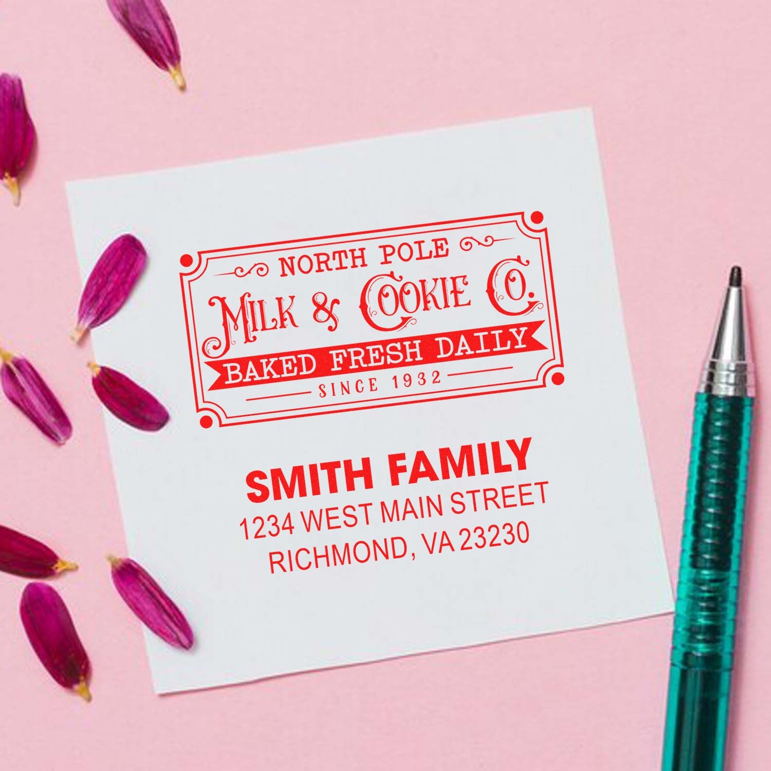 Custom rubber stamp mockup for holiday bakery branding, featuring North Pole Milk & Cookie Co. and a Smith Family address design.