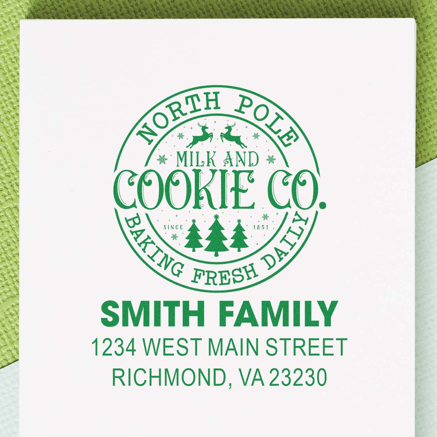 Personalized holiday rubber stamp design for Smith Family, North Pole Milk and Cookie Co., with Richmond, VA return address.
