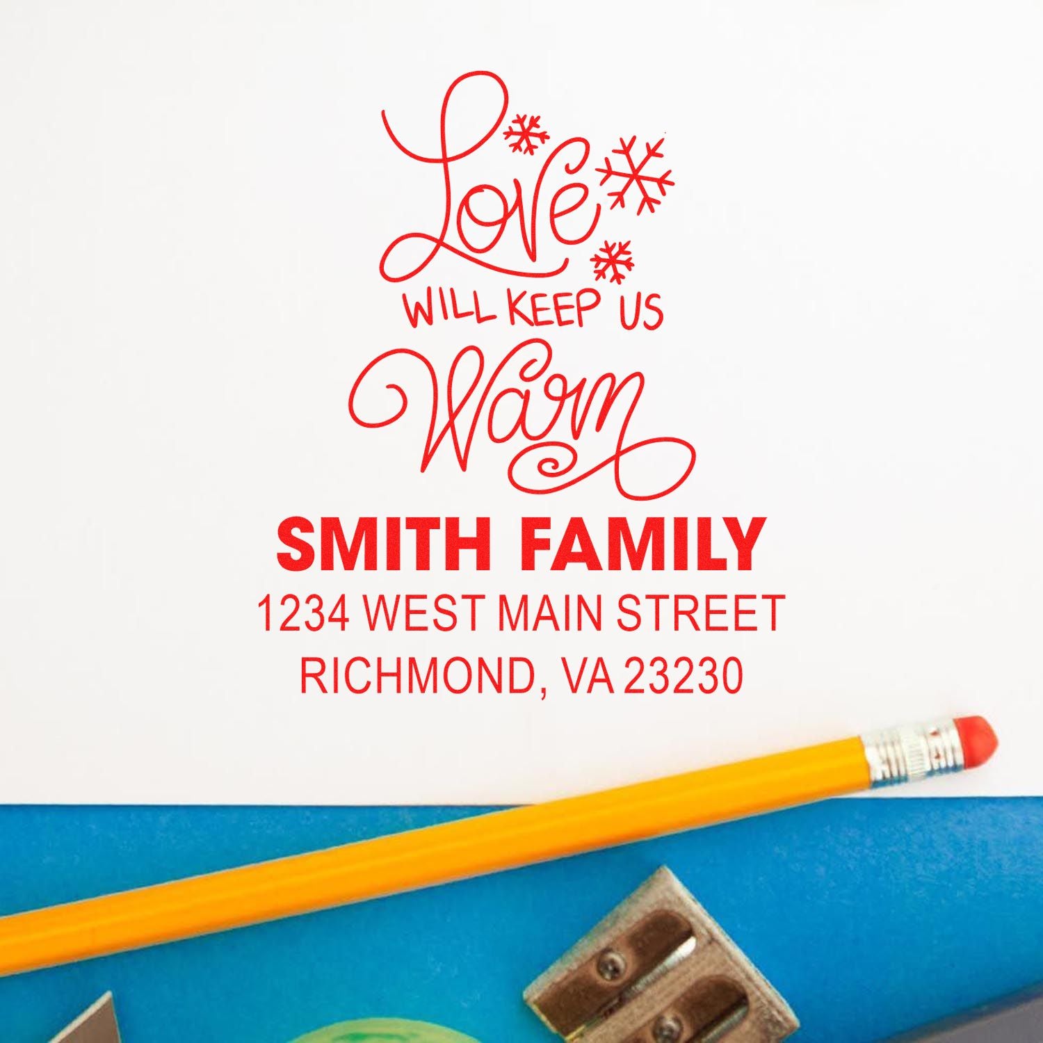 Personalized holiday rubber stamp with Love will keep us warm, Smith Family name and address for Christmas cards.