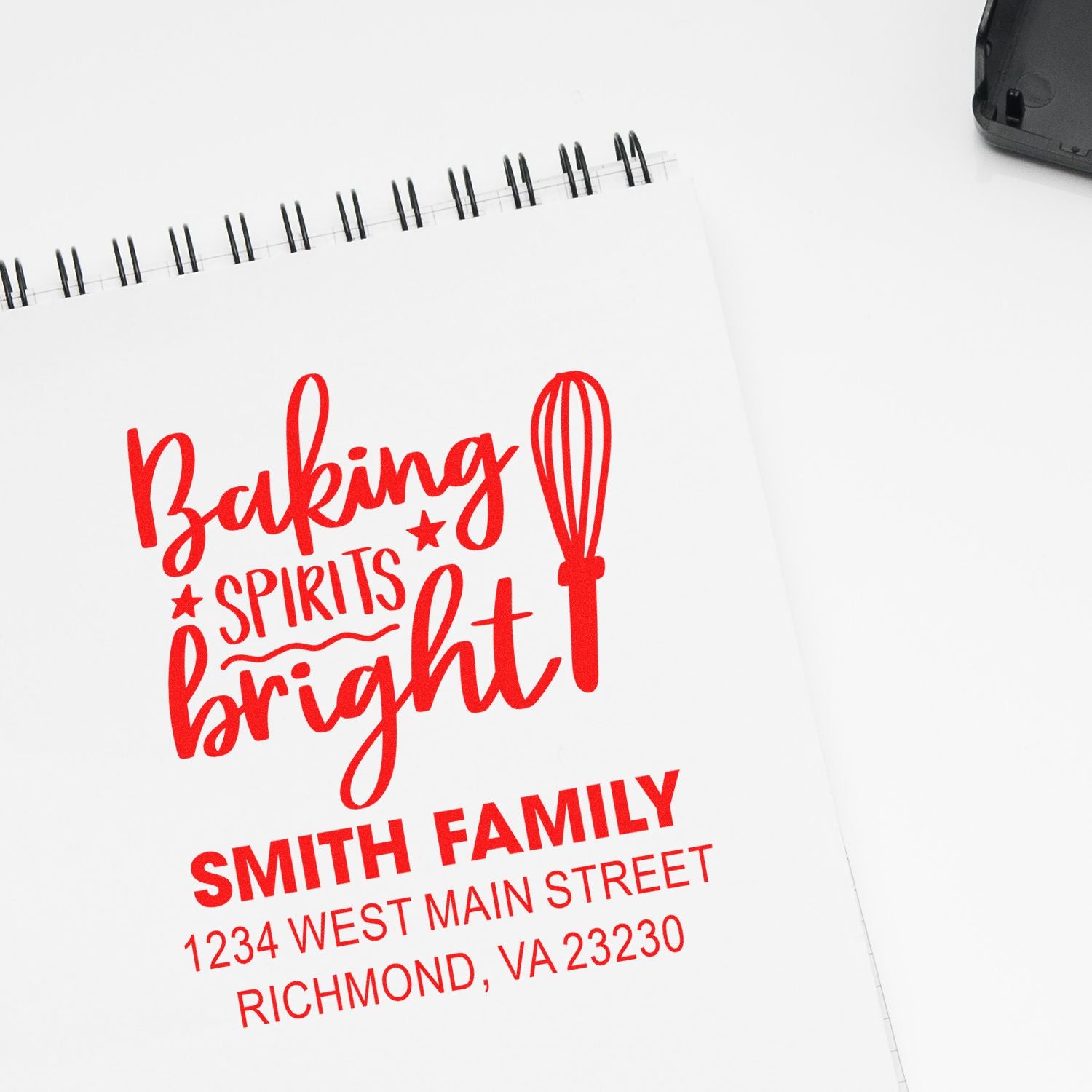 Custom rubber stamp design for holiday baking: Baking Spirits Bright with Smith Family address in red.