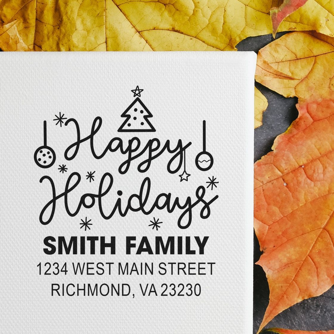 Personalized Happy Holidays return address rubber stamp with festive Christmas ornament design and family name address.