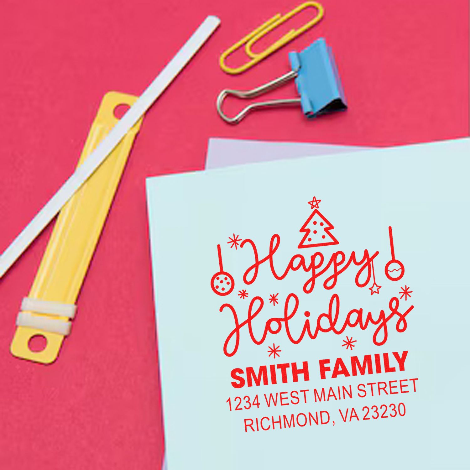 Custom holiday rubber stamp design for personalized cards and envelopes, featuring Happy Holidays, Smith Family, and address.