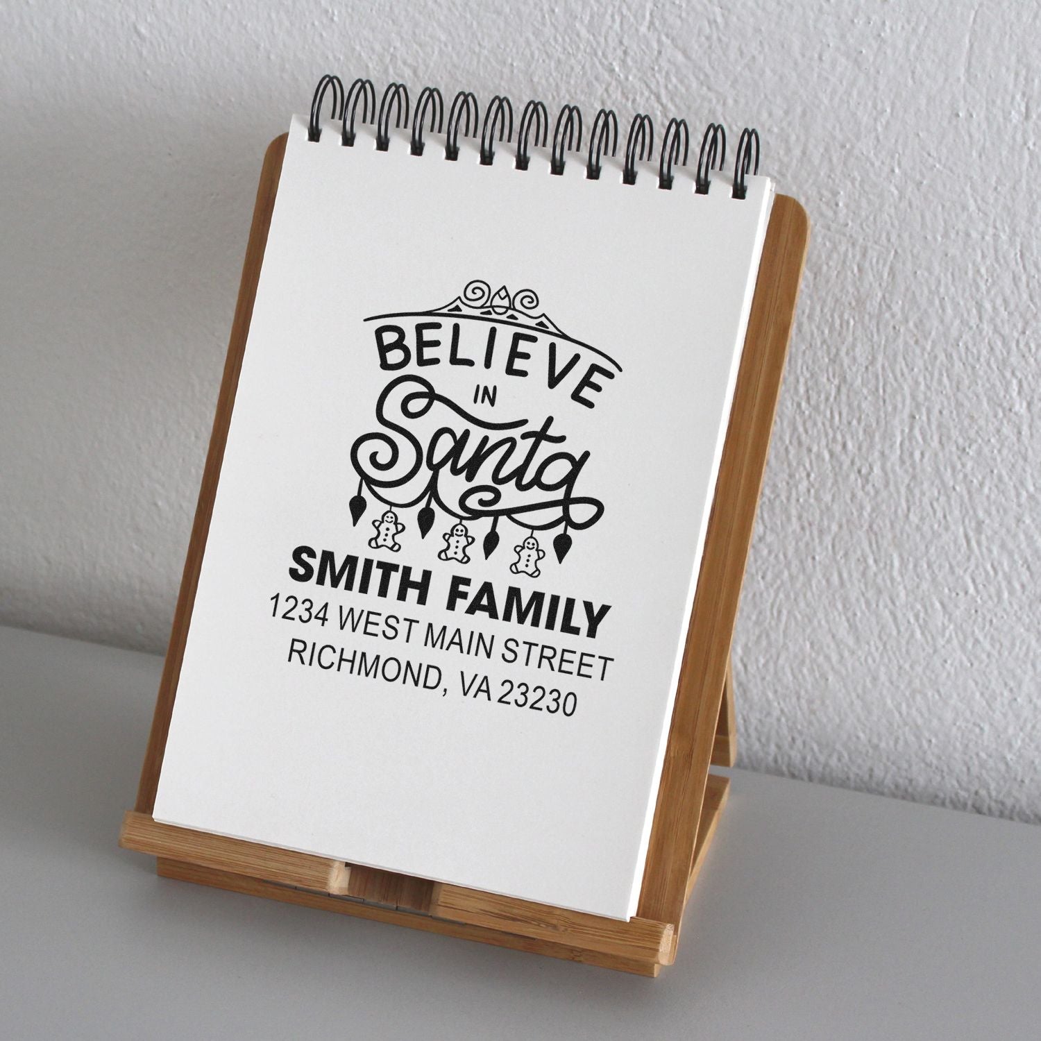 Custom Believe in Santa family return address rubber stamp for personalized Christmas cards and holiday mail.