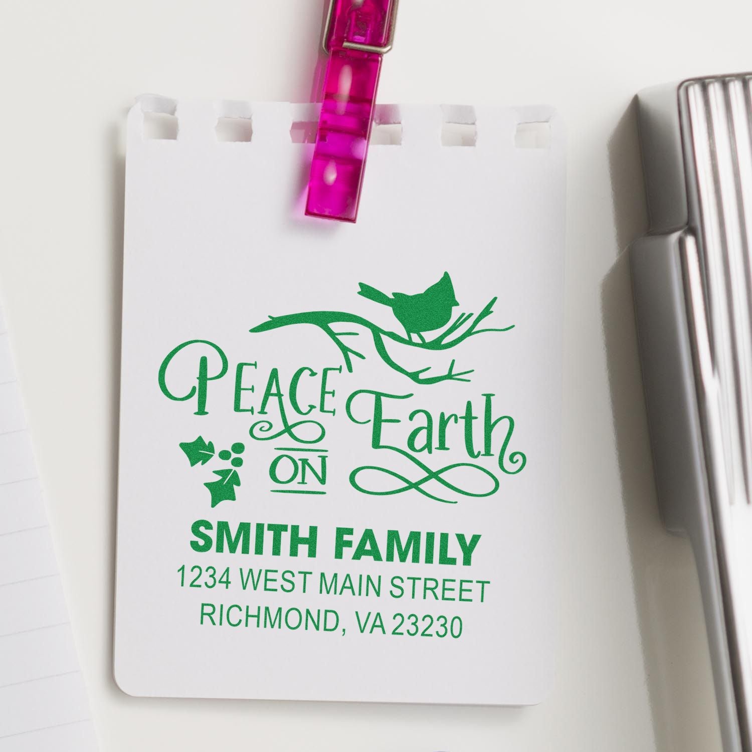 Custom rubber address stamp with Peace Earth design and Smith Family return address in green ink.