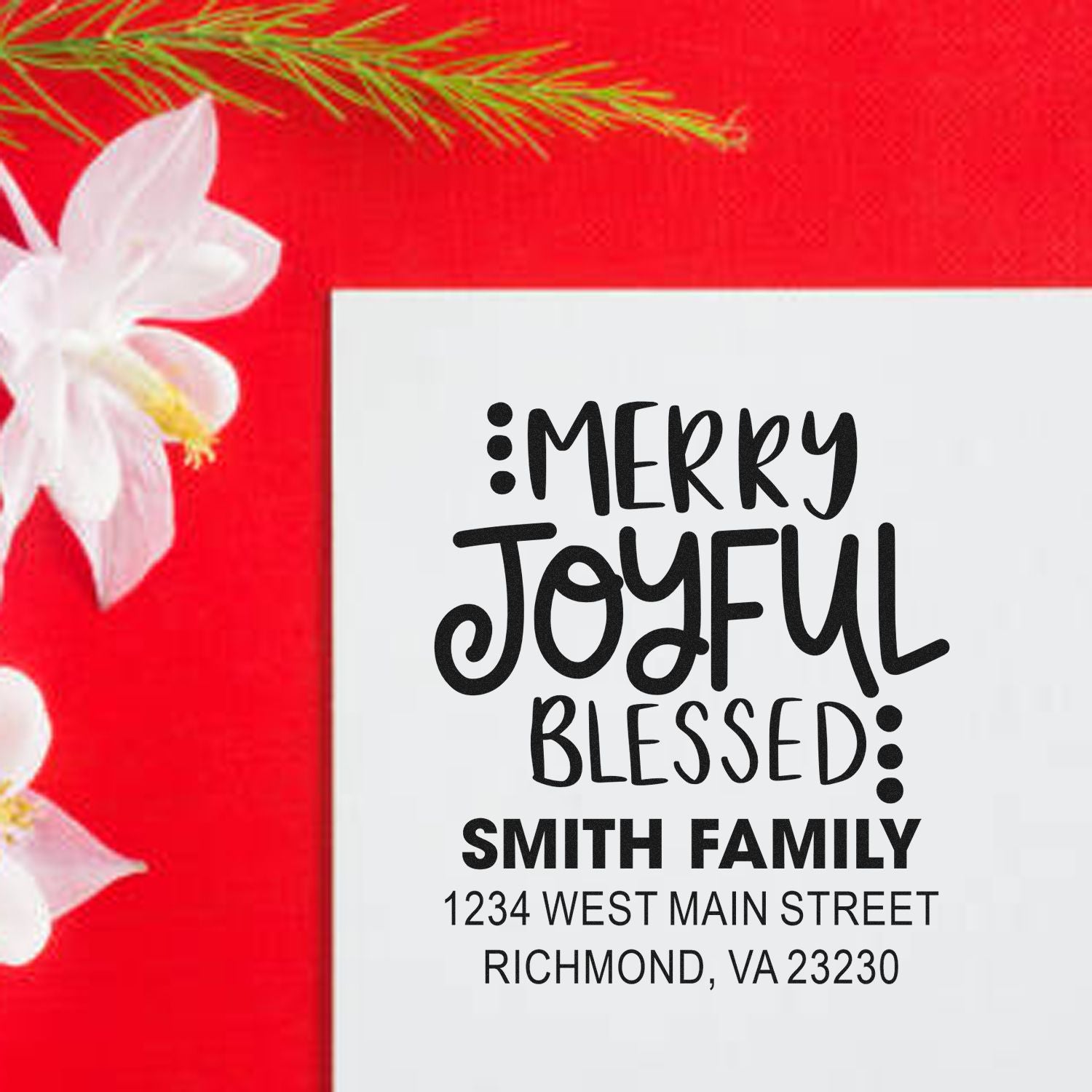 Personalized holiday rubber stamp with Merry Joyful Blessed Smith family return address on a festive red Christmas card.