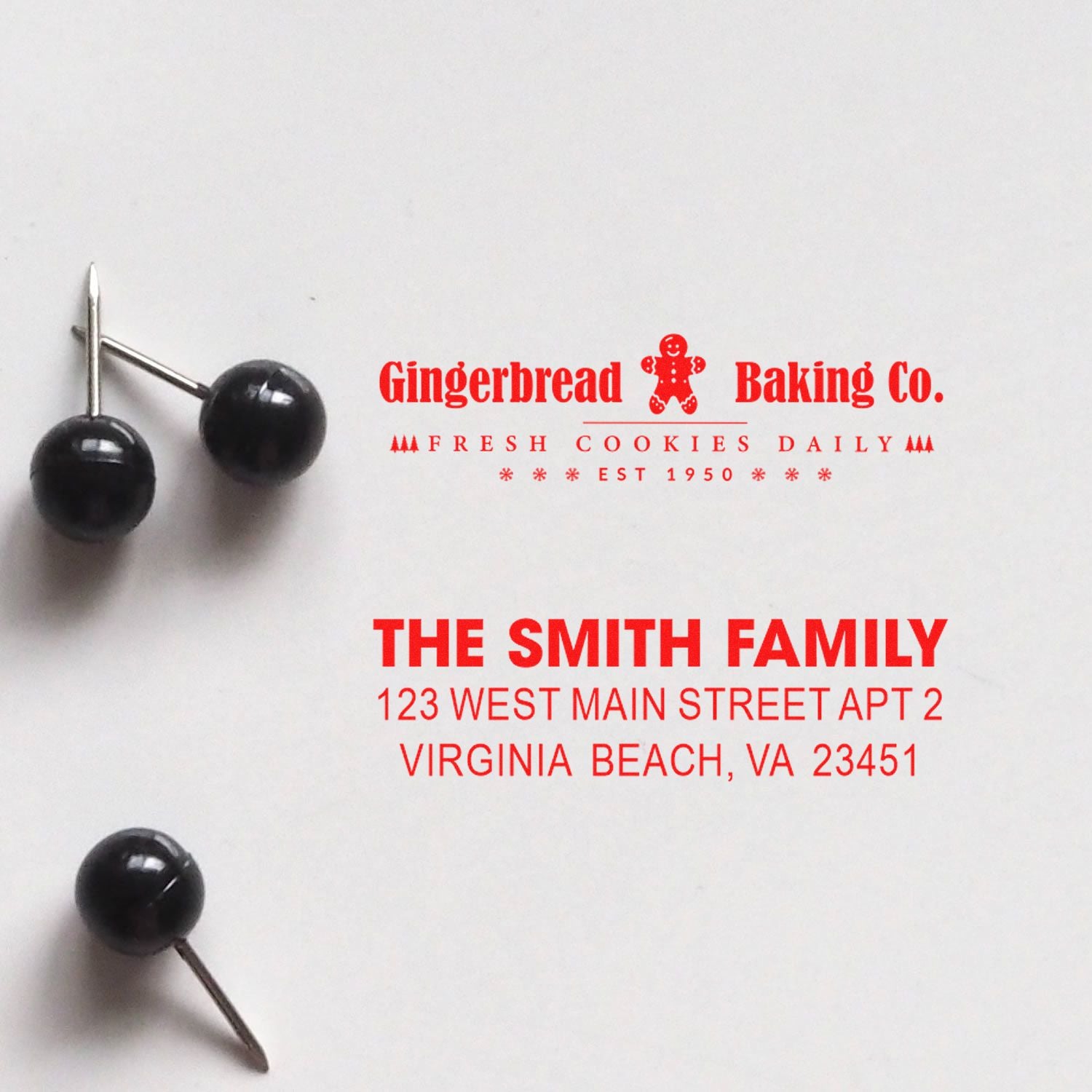 Custom rubber stamp samples with bakery logo and return address imprint for Gingerbread Baking Co. and The Smith Family.