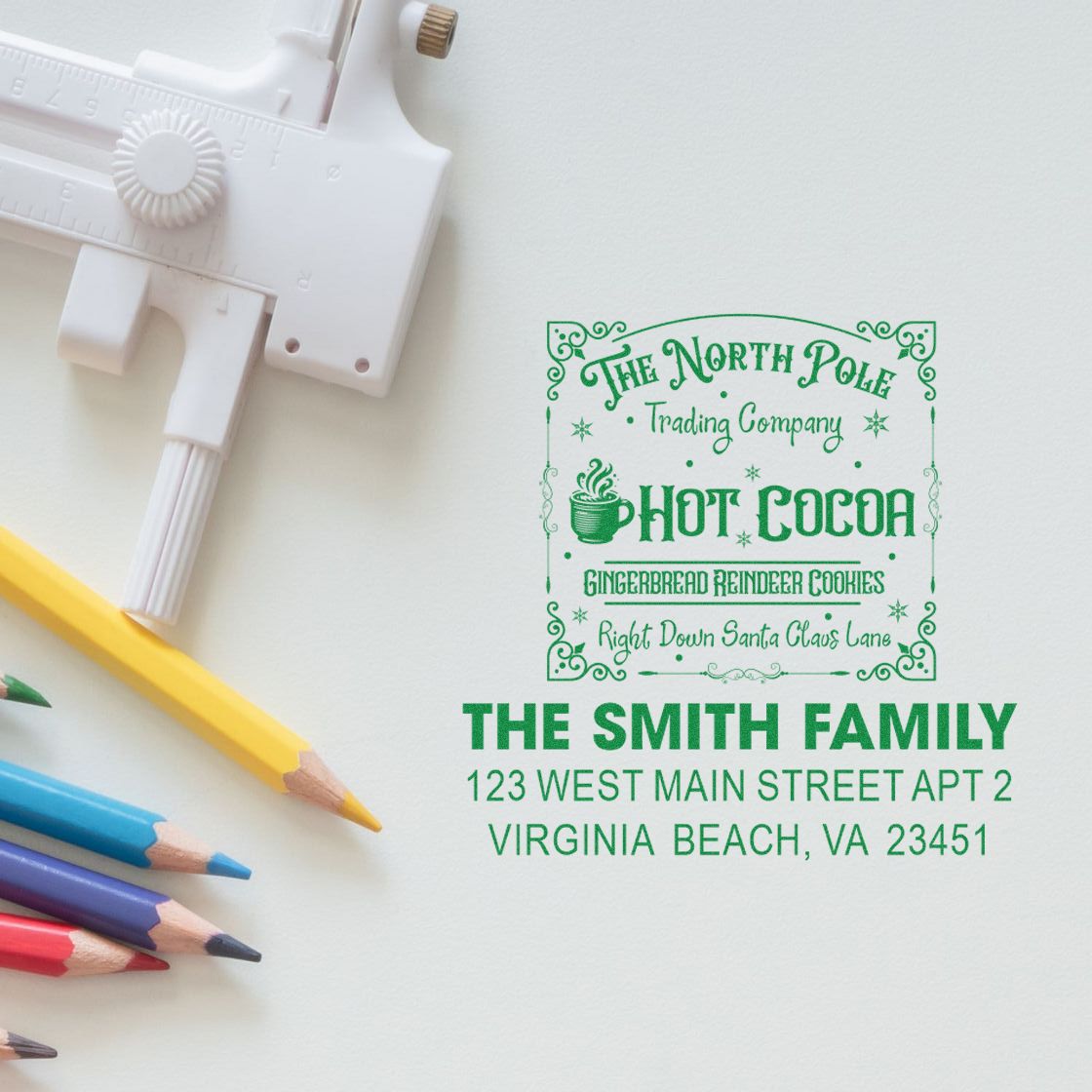 Custom address rubber stamp with festive North Pole Hot Cocoa design for holiday mailings.