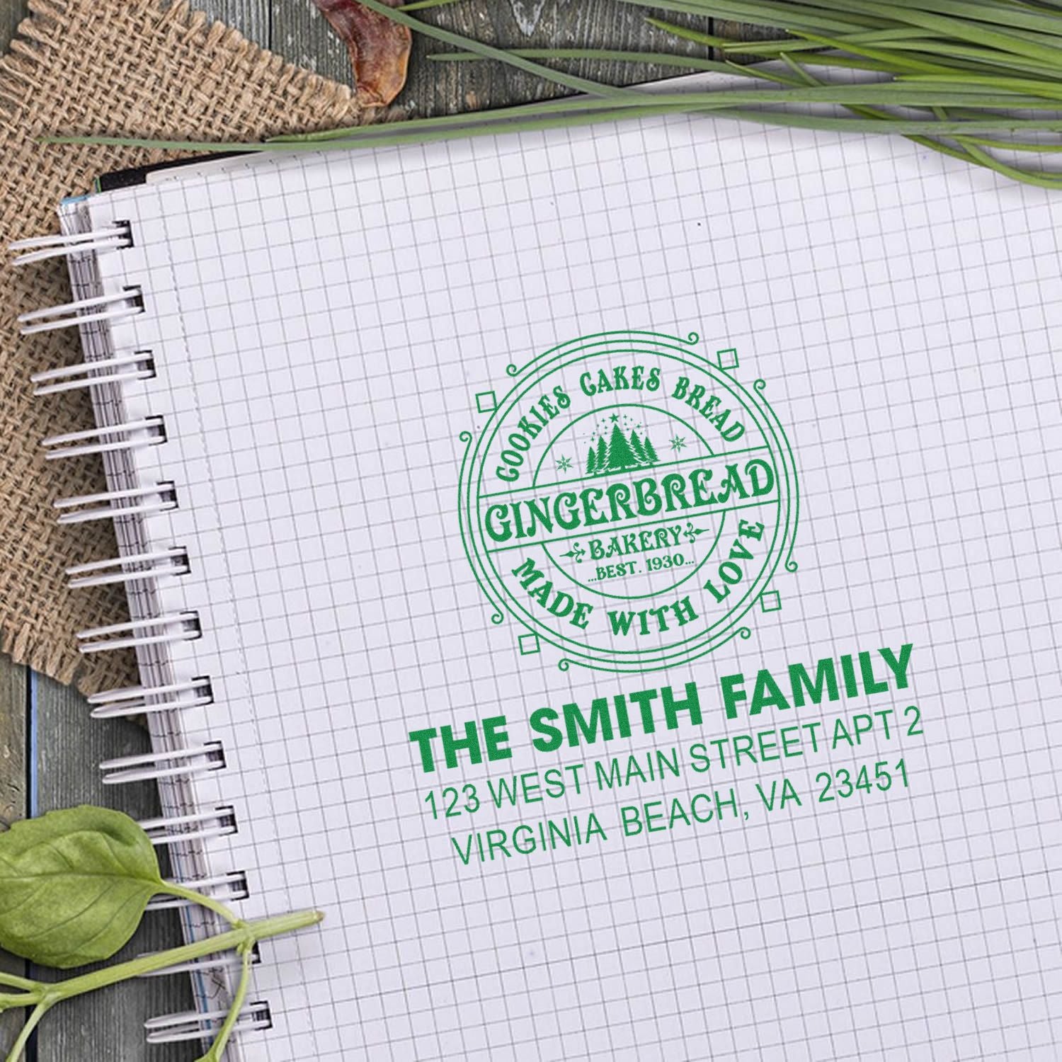 Custom bakery rubber stamp and personalized address stamp mockup on a notebook for branding and packaging.