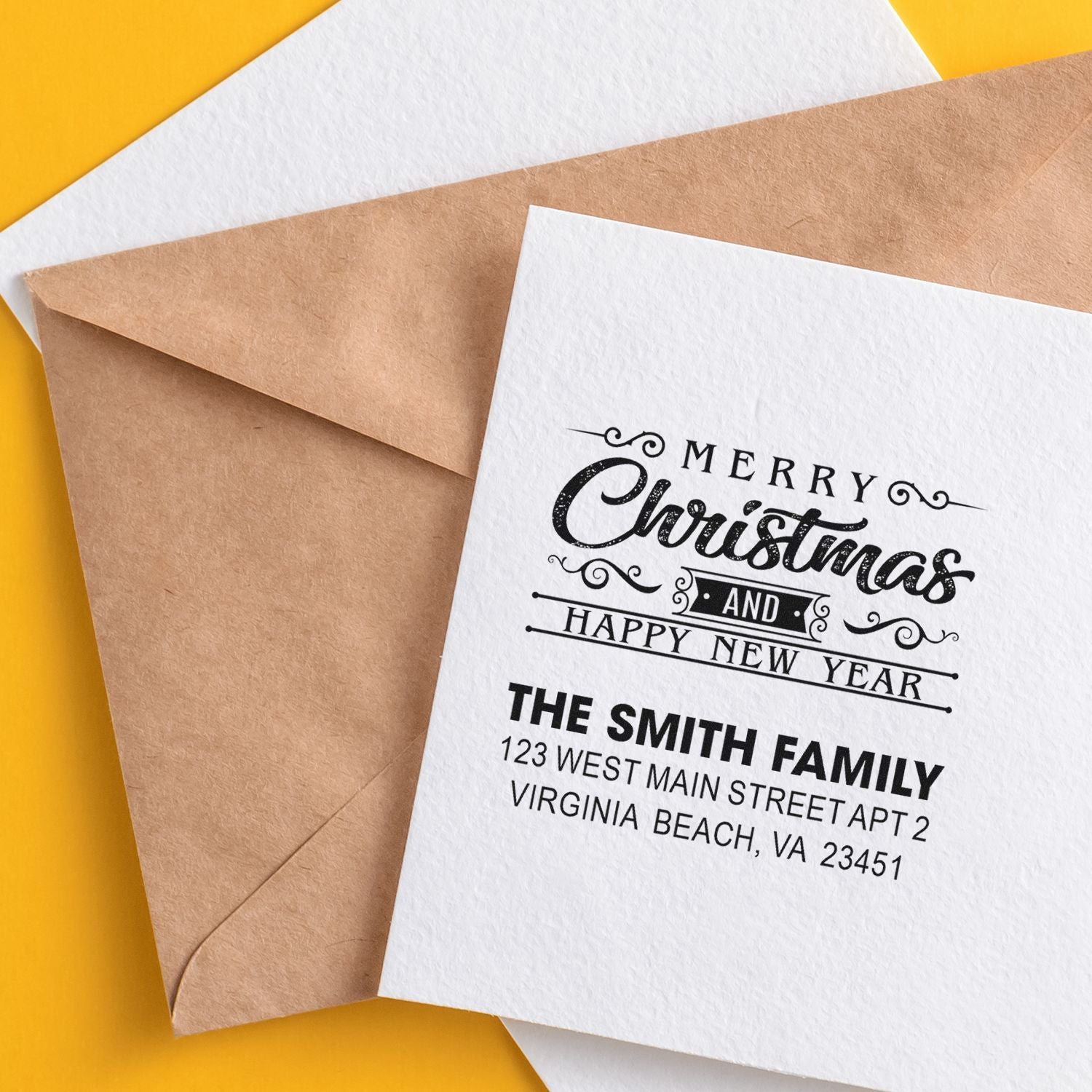 Personalized holiday return address rubber stamp on Christmas card with Merry Christmas and Happy New Year greeting.