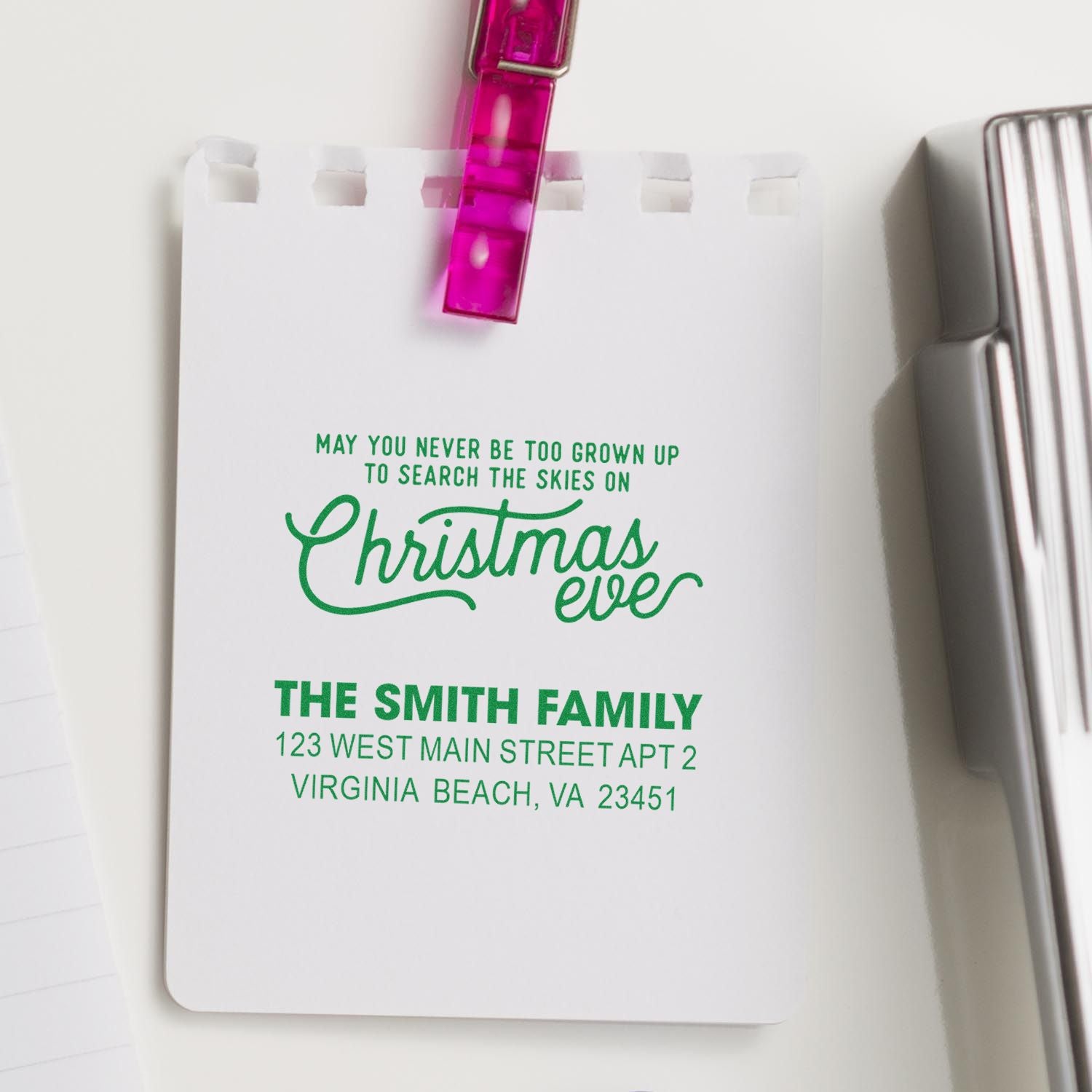 Custom Christmas return address rubber stamp for holiday cards, featuring a family name, address, and festive message.