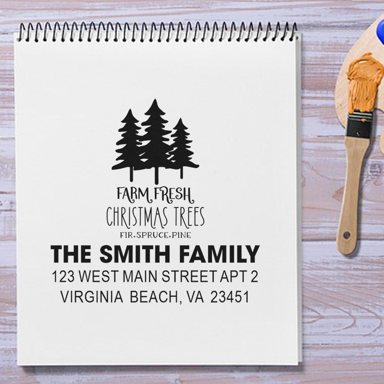 Custom Christmas tree address rubber stamp for holiday cards, featuring family name and return address.