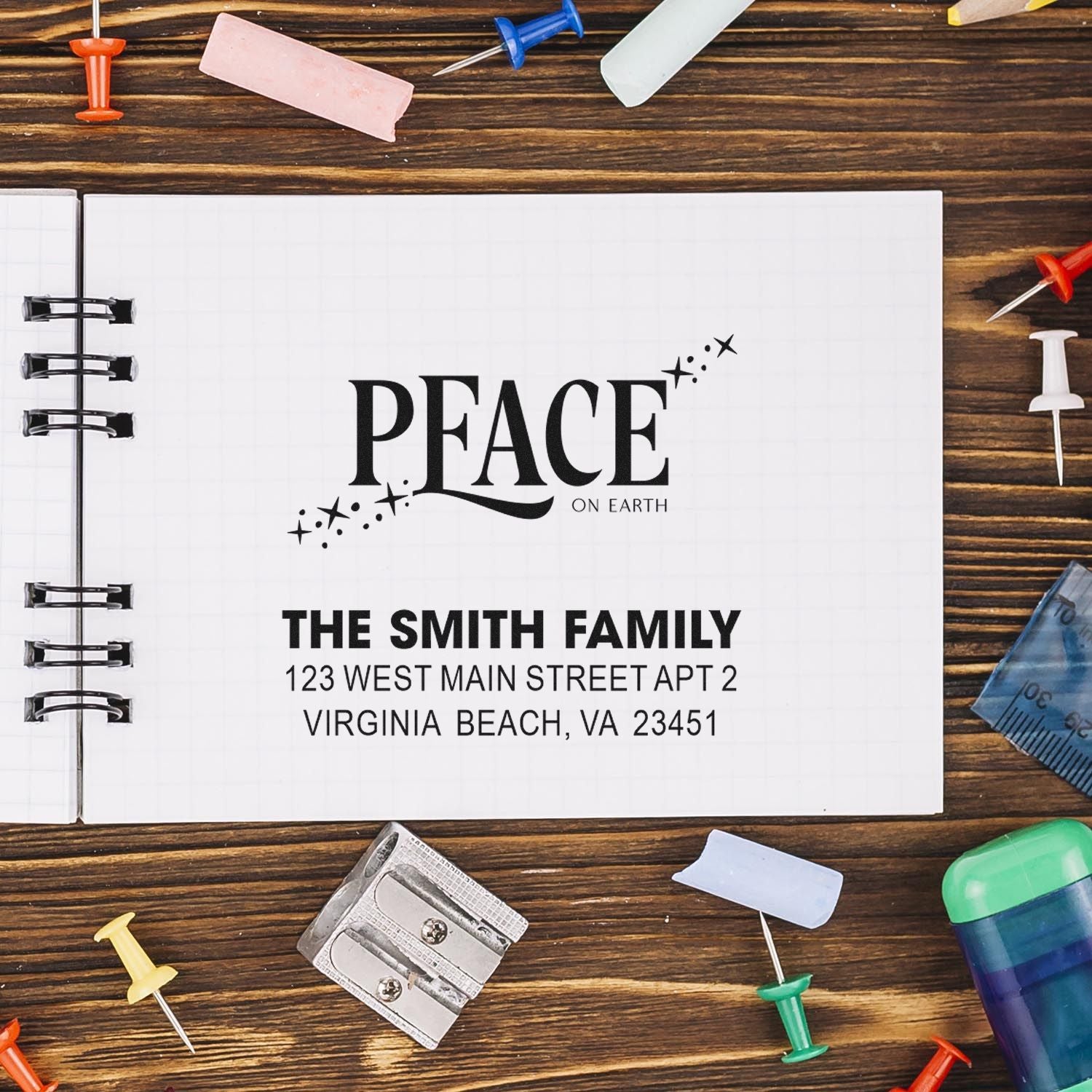 Personalized rubber address stamp design with Peace on Earth and family address for holiday mail and crafting.